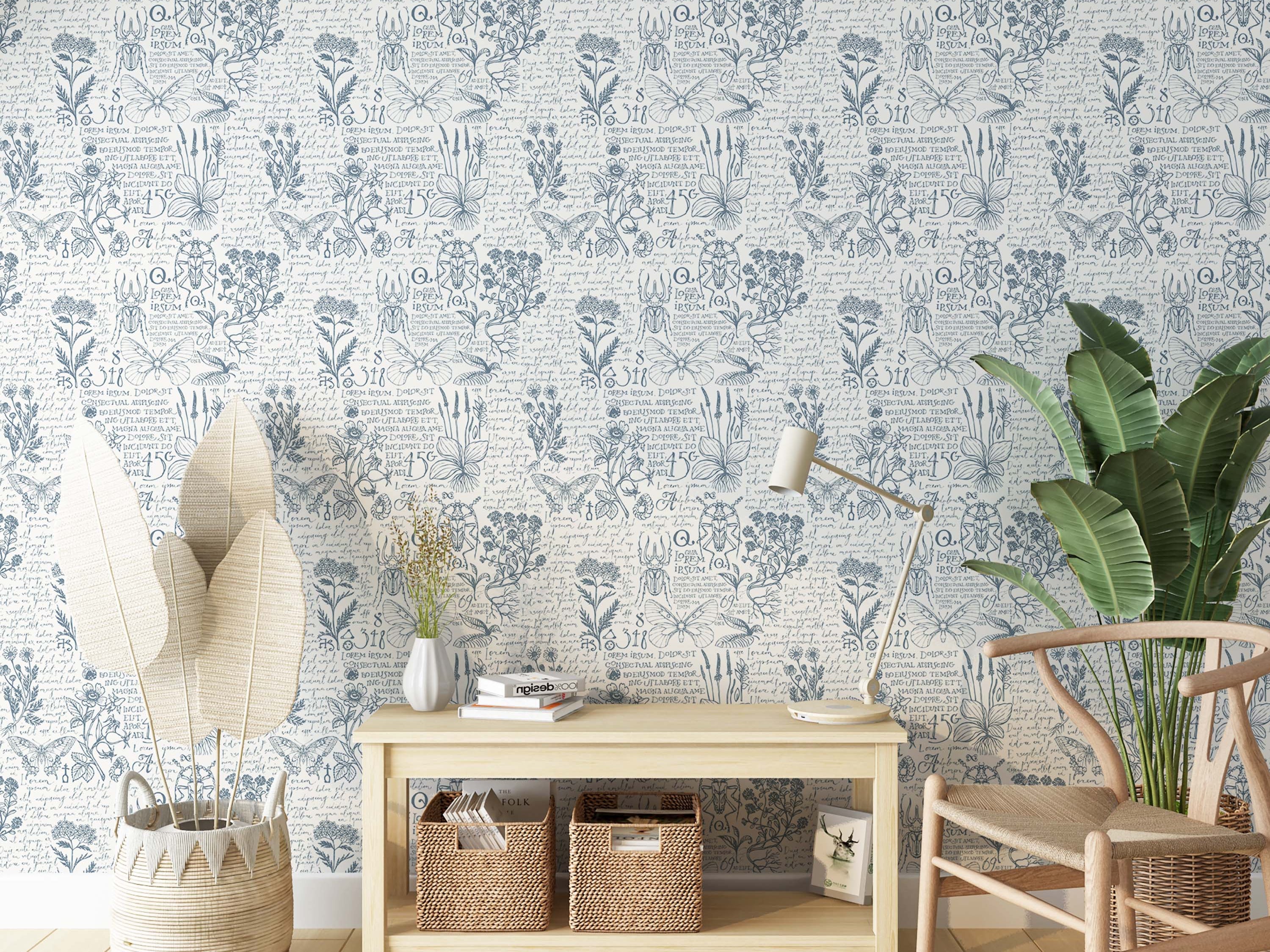 Vintage wallpaper with blue botanical illustrations, insects, and cursive script on a creamy white background.