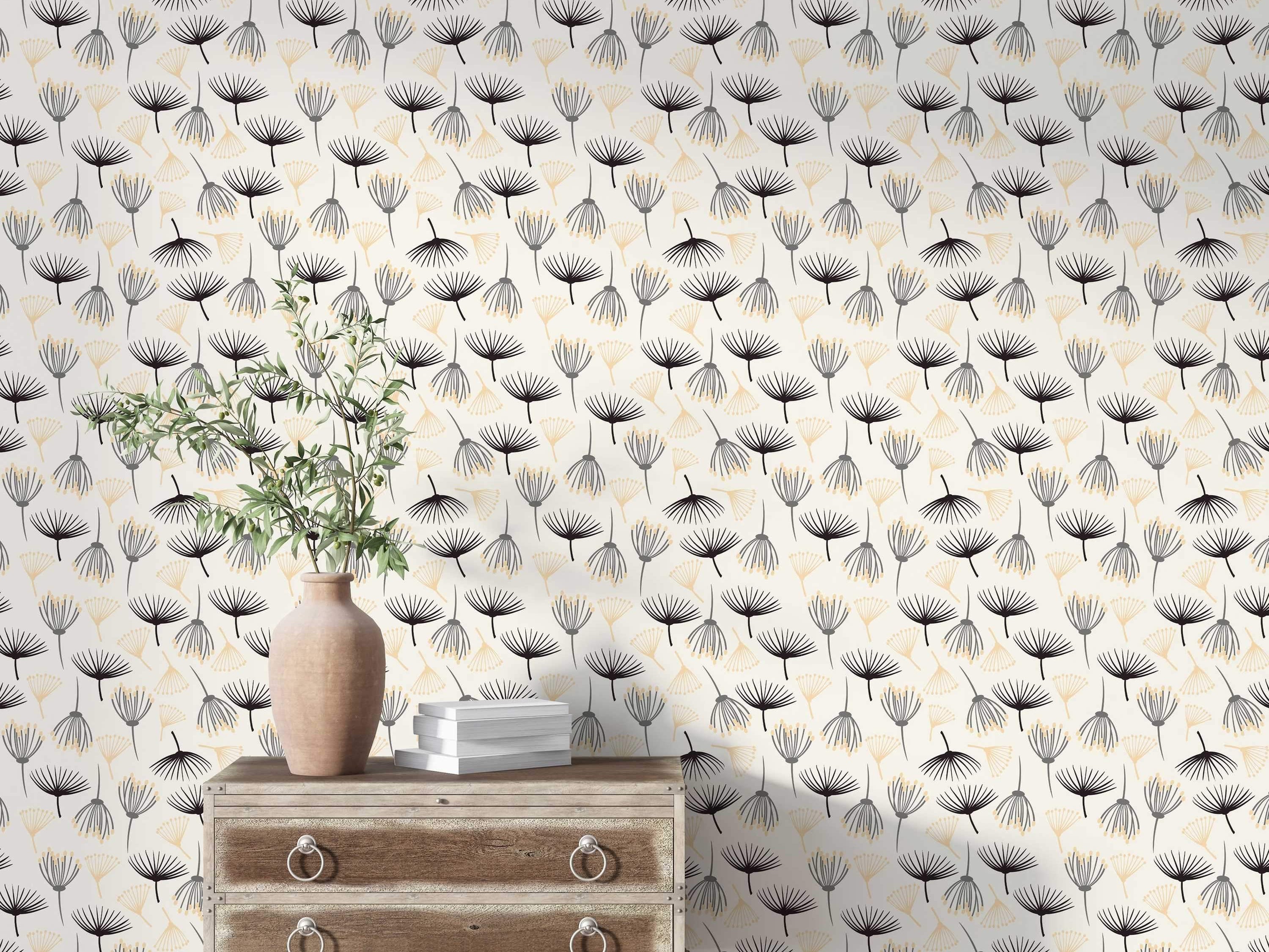 Wallpaper featuring a repeating pattern of abstract botanical seed shapes in black, grey, and pale yellow on an off-white background.