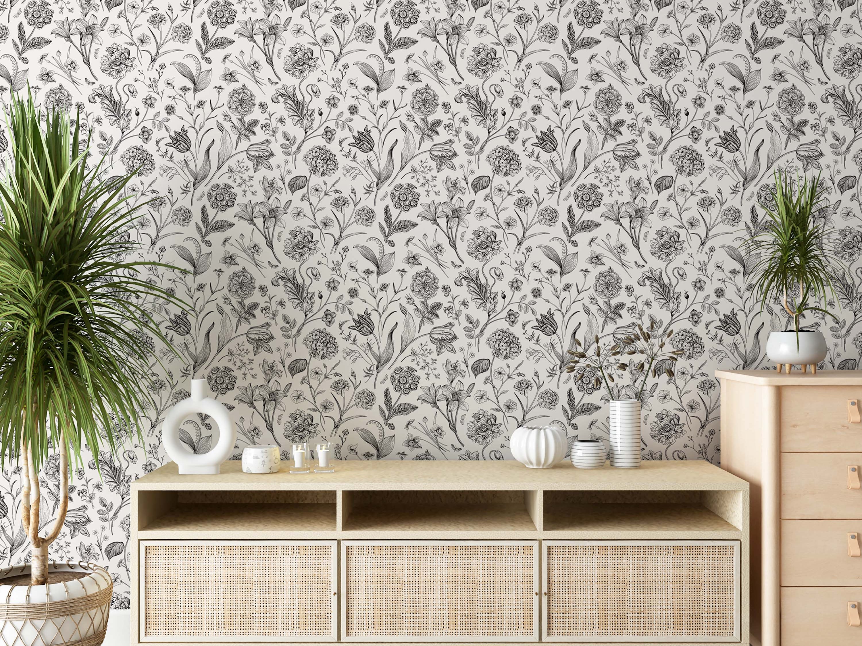 Black and white botanical sketch wallpaper displaying a dense, repeating pattern of finely detailed flowers and leaves.