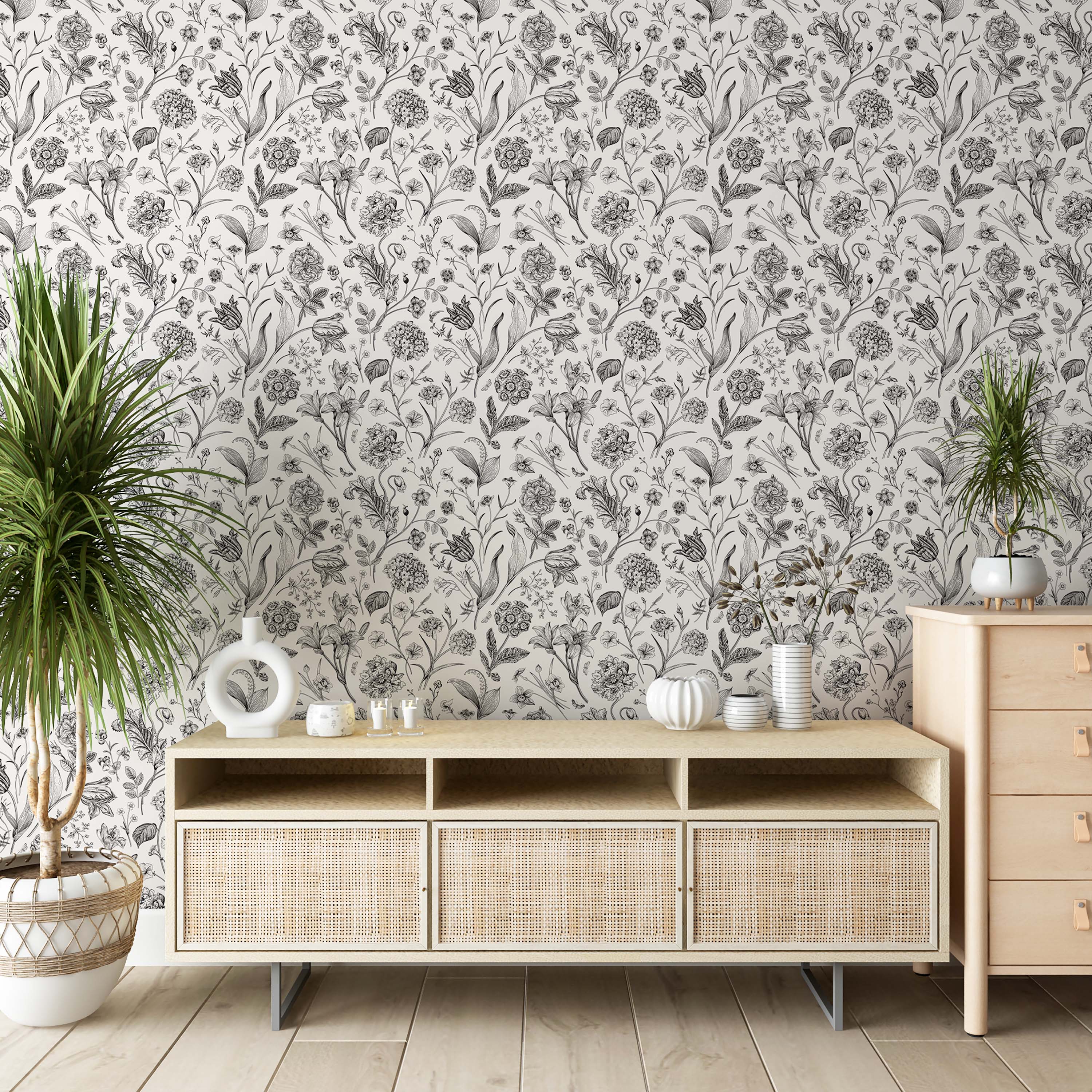 Black and white botanical sketch wallpaper displaying a dense, repeating pattern of finely detailed flowers and leaves.