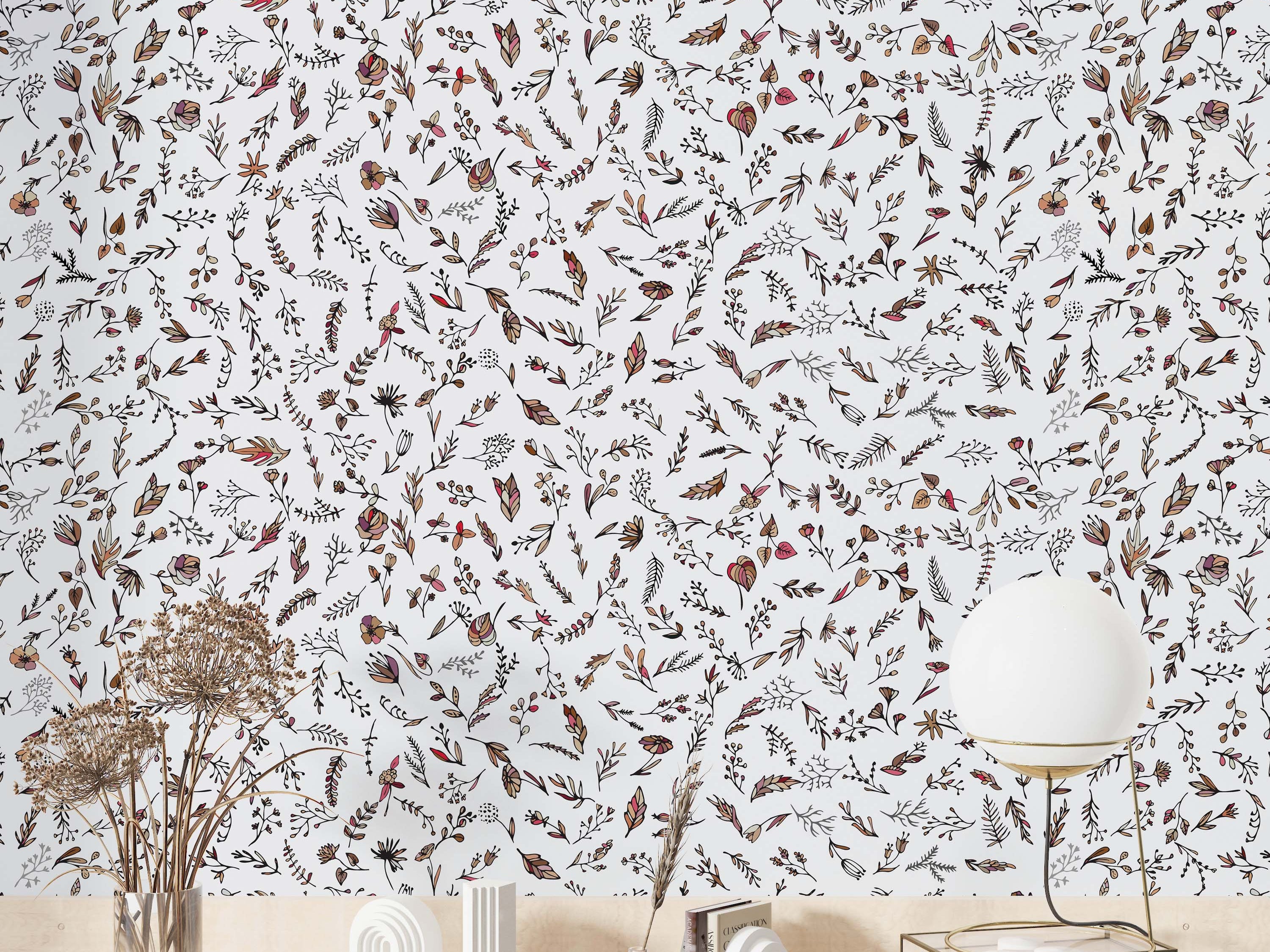 Delicate wallpaper featuring hand-drawn botanical sprigs, leaves, and flowers in brown, pink, and beige on a white background.