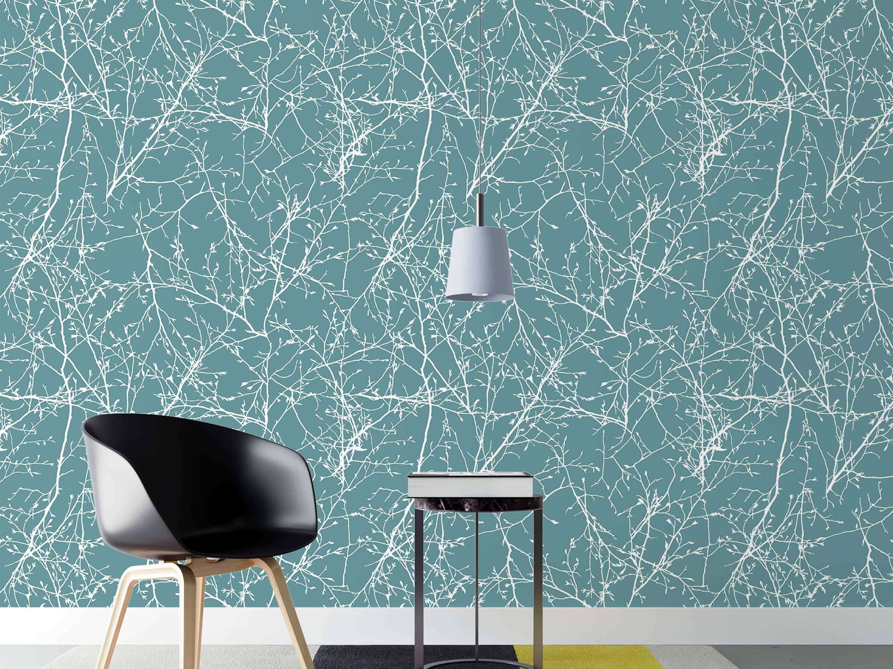 Wallpaper with a pattern of tangled white tree branches and twigs on a solid dusty teal background.