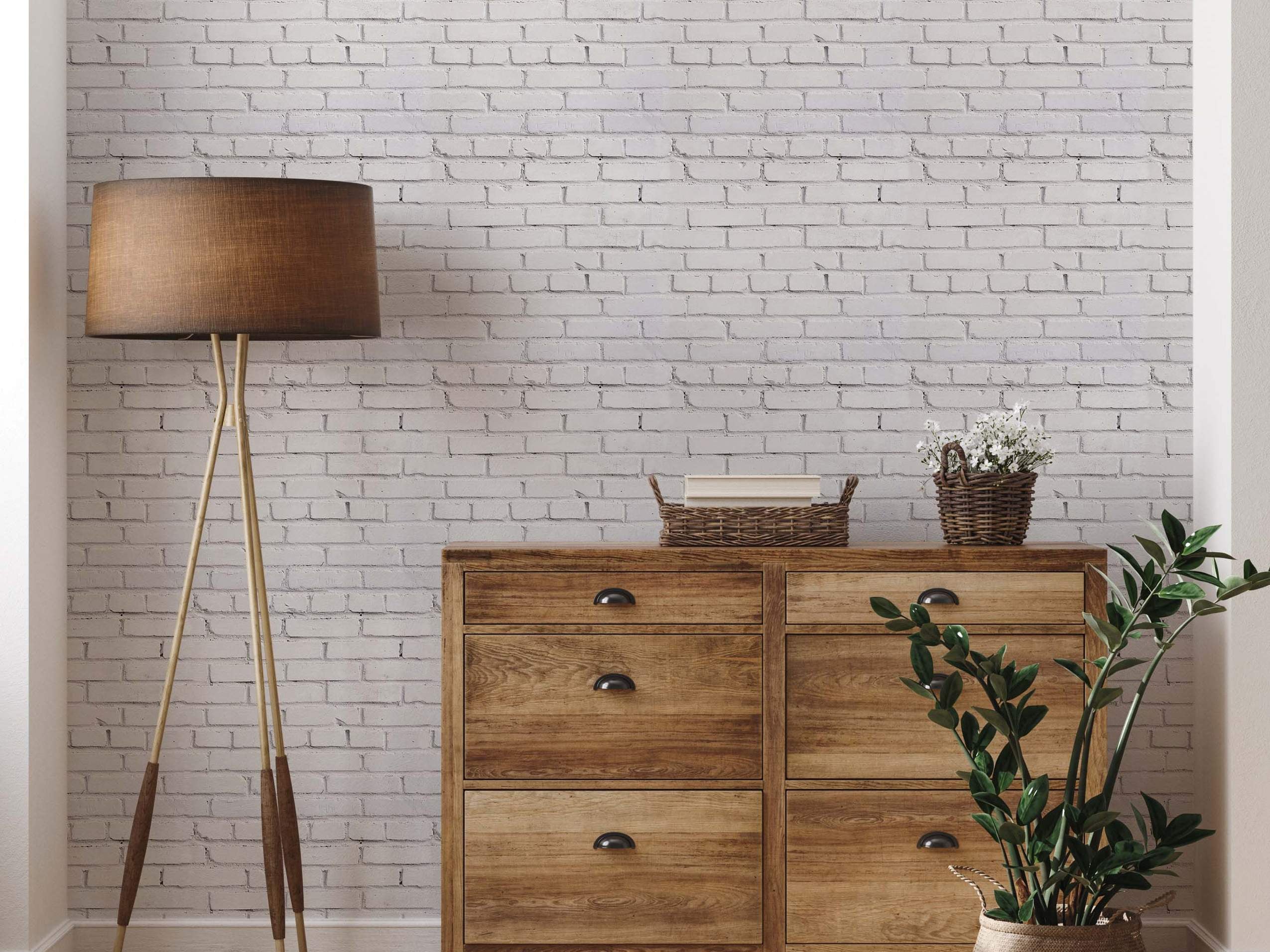 Wallpaper featuring a realistic white painted brick pattern with subtle texture and grey mortar lines.