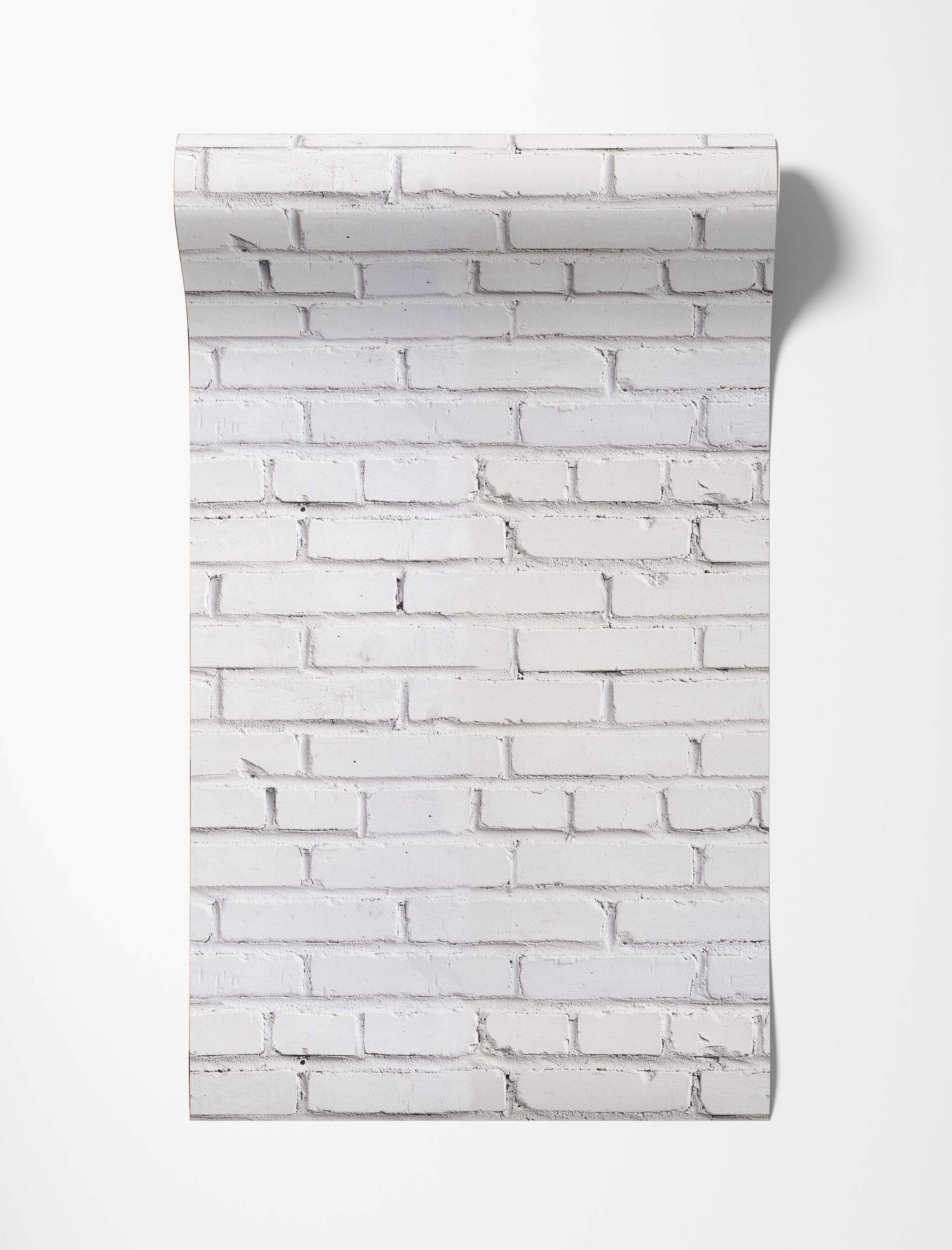 Wallpaper featuring a realistic white painted brick pattern with visible texture and light gray mortar lines.