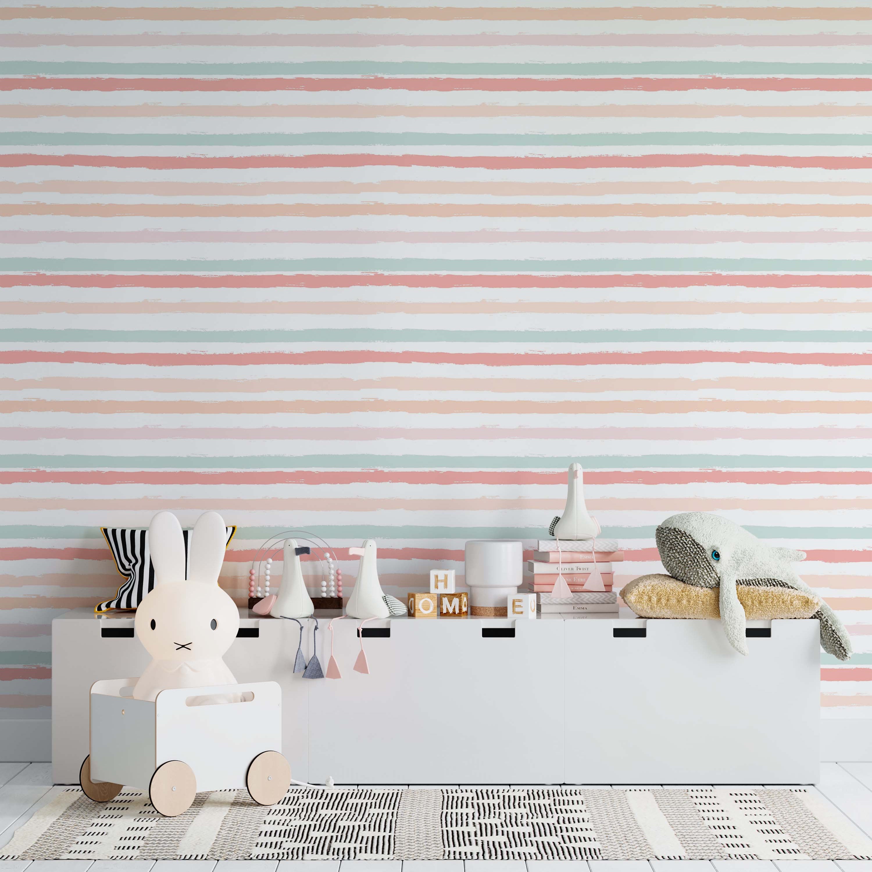 Wallpaper featuring horizontal brushed stripes in pastel pink, peach, and mint green on an off-white background.