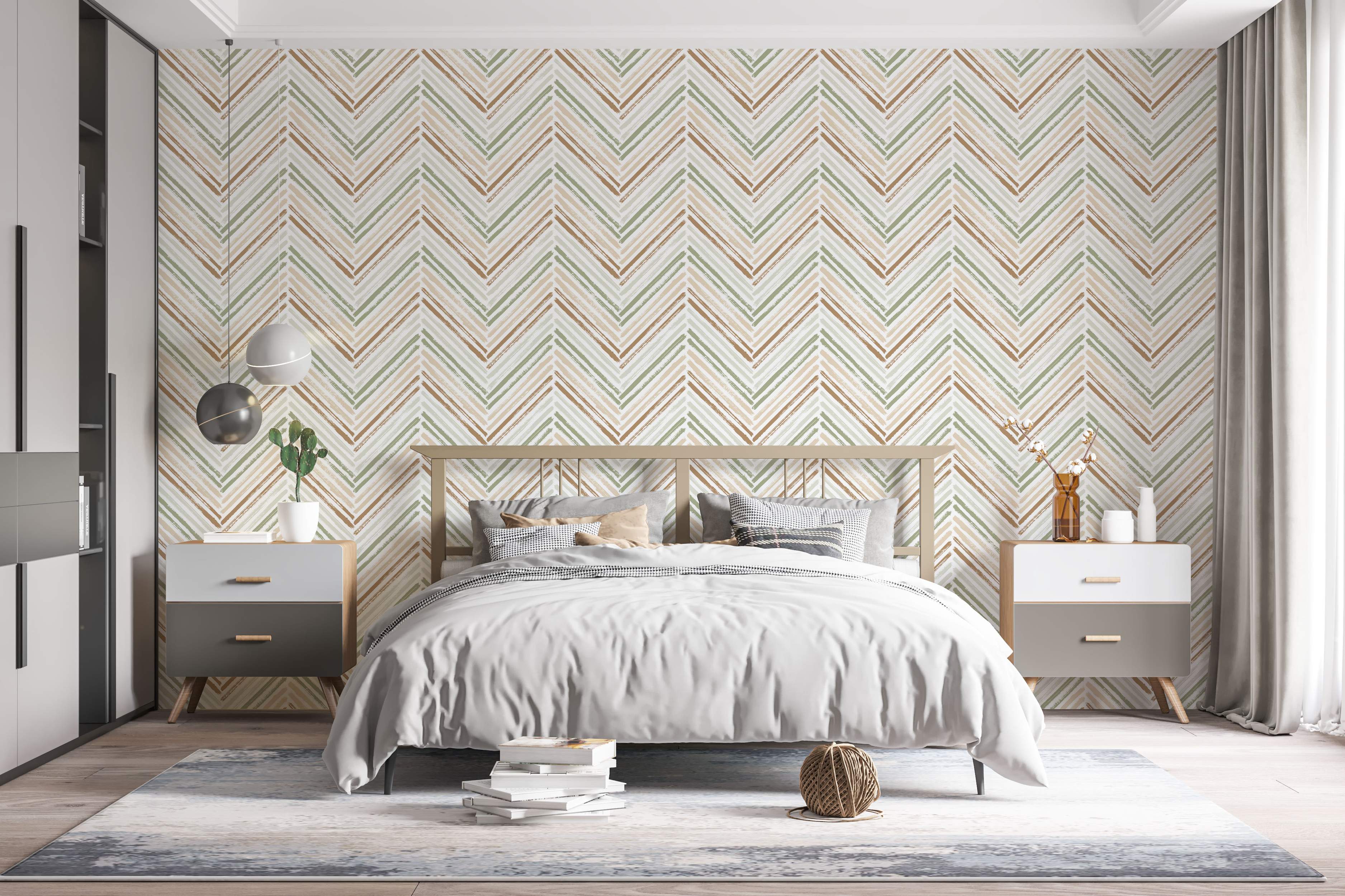 Wallpaper featuring a brushstroke chevron pattern with lines in earthy green, brown, and beige tones on a light background.