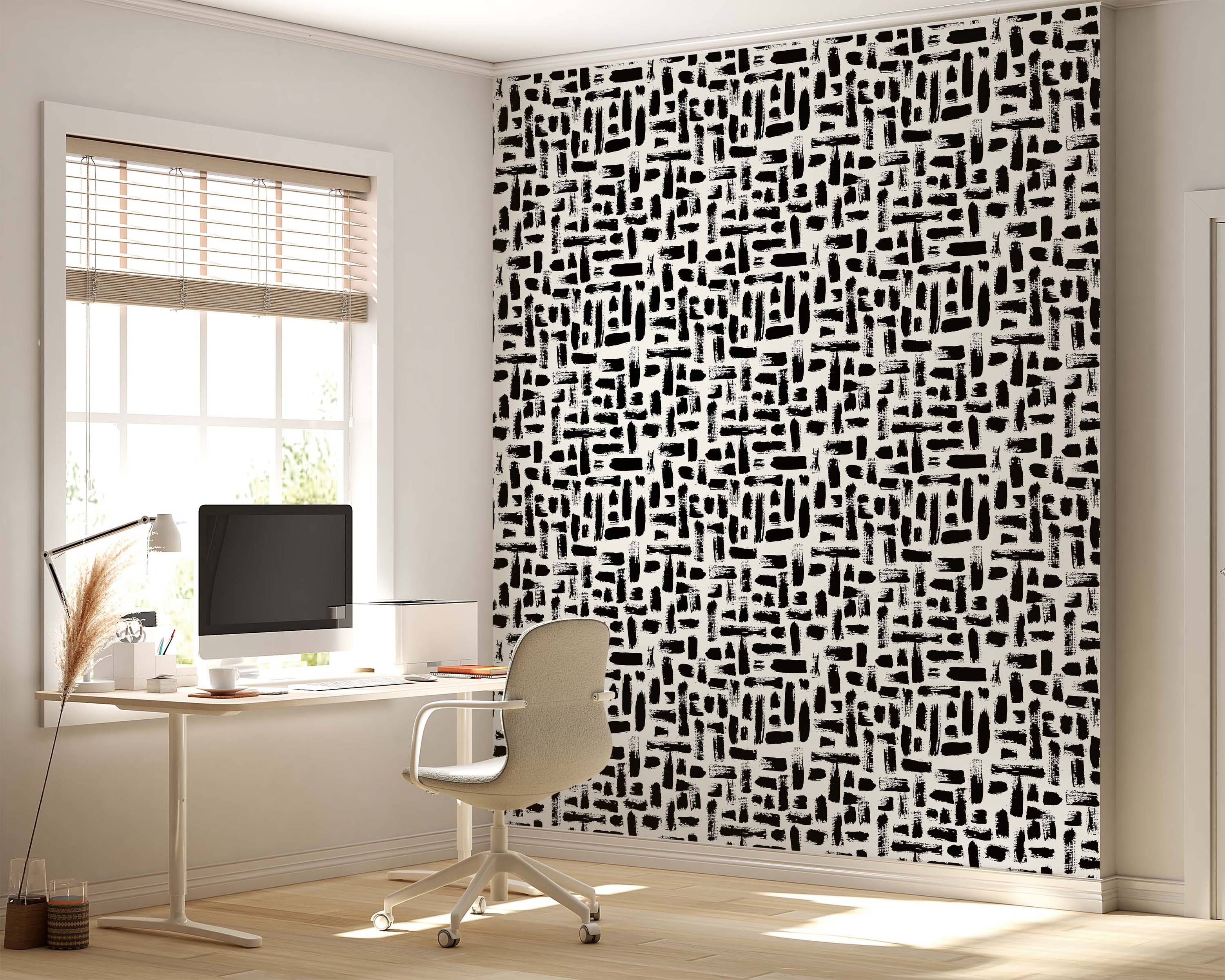 Abstract wallpaper featuring textured black brushstrokes arranged in a dash-like pattern on a white background.