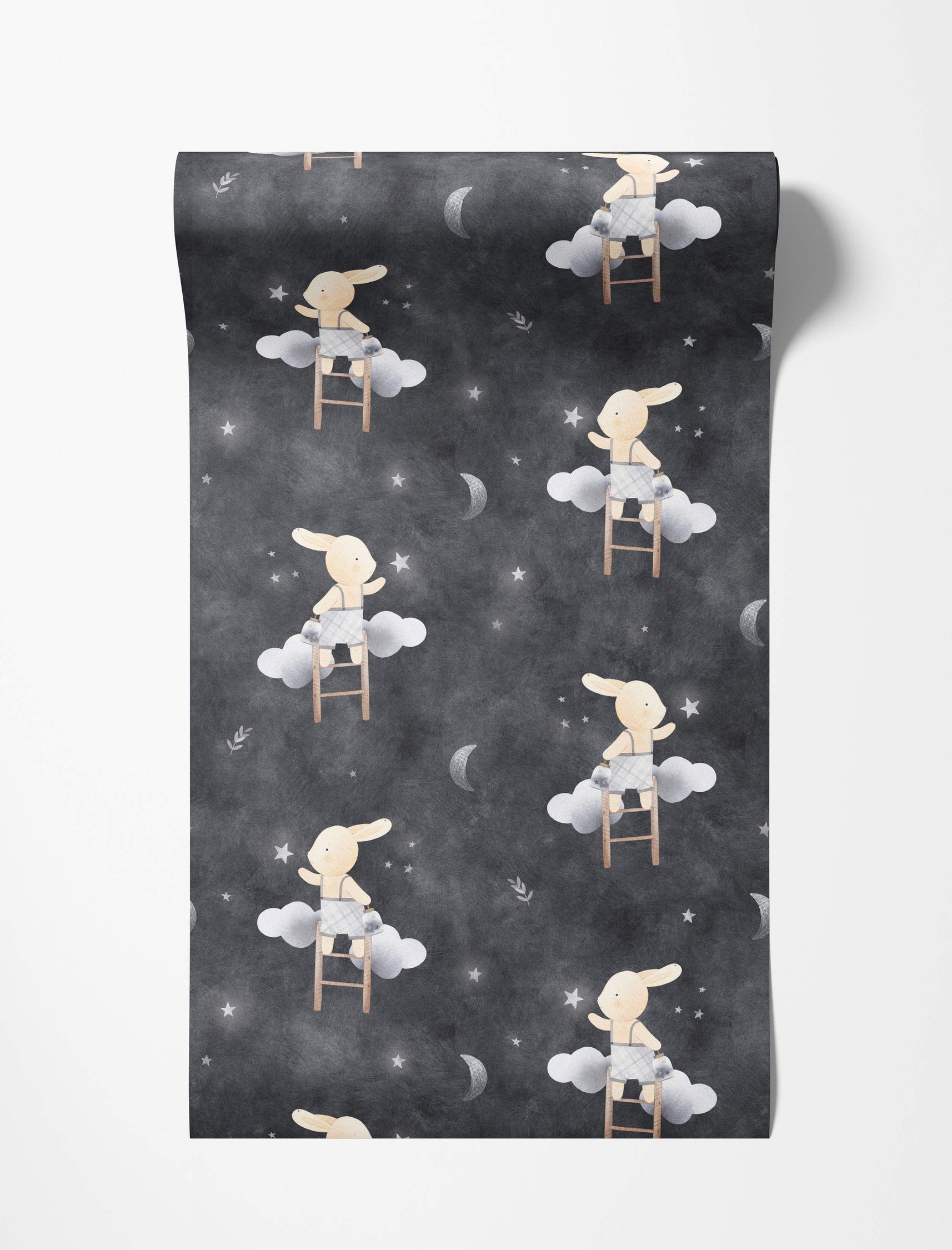 Whimsical wallpaper featuring bunnies on ladders reaching for stars and moons amidst clouds on a dark gray night sky background.