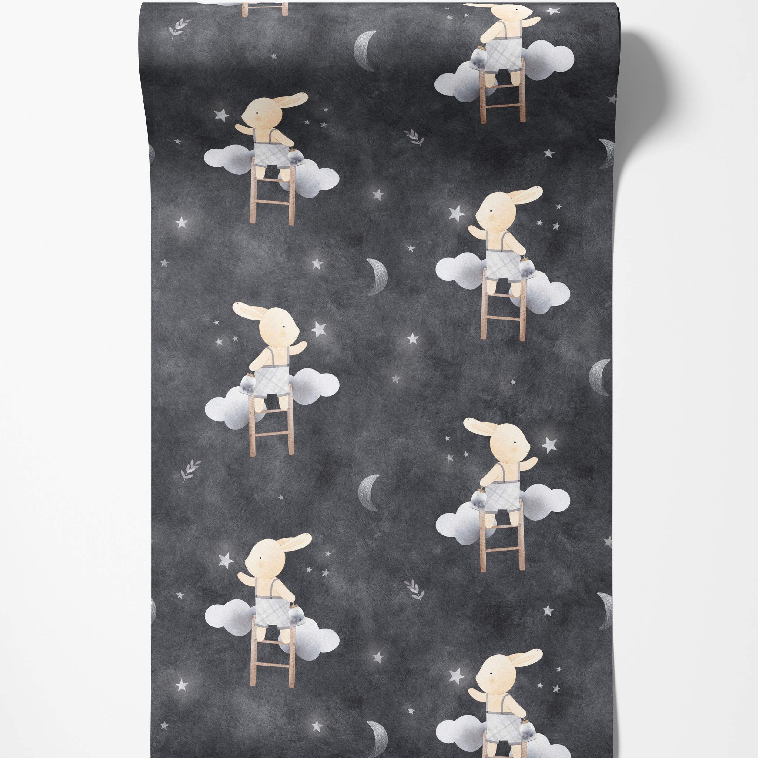 Whimsical wallpaper featuring bunnies on ladders reaching for stars and moons amidst clouds on a dark gray night sky background.