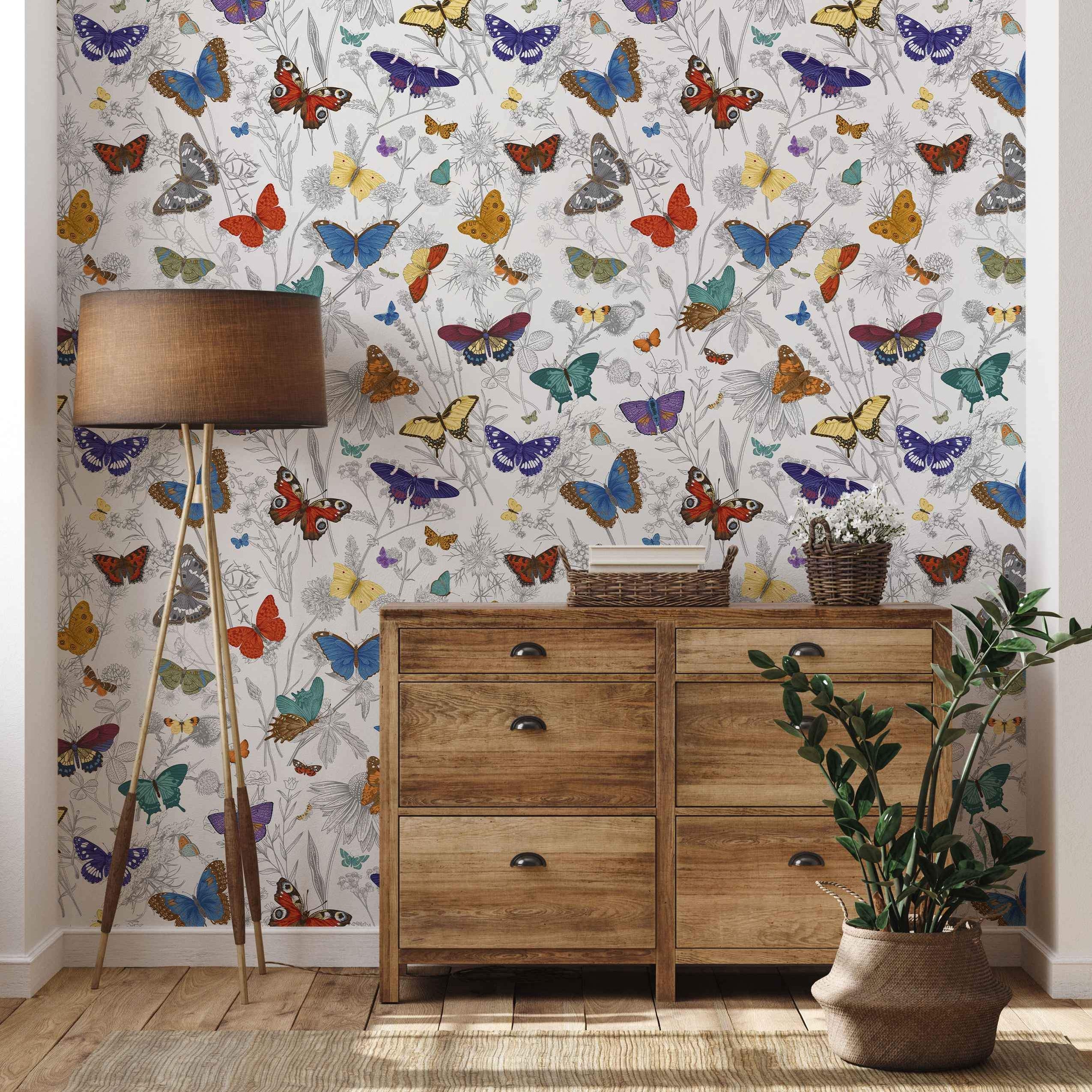Colorful illustrated butterfly wallpaper with gray sketched botanical drawings on a light background.