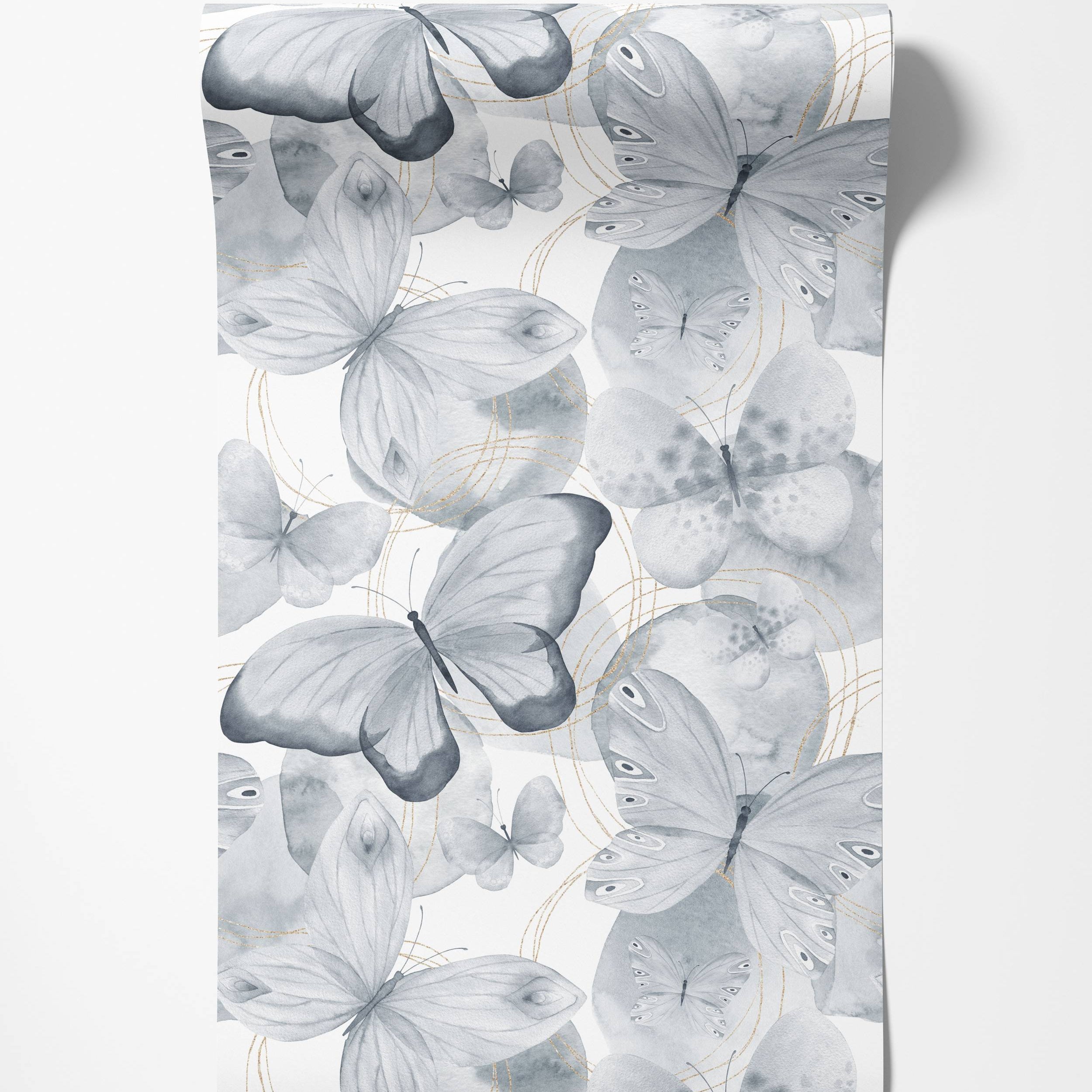 Repeating wallpaper pattern of gray watercolor butterflies and delicate gold line accents on a white background.