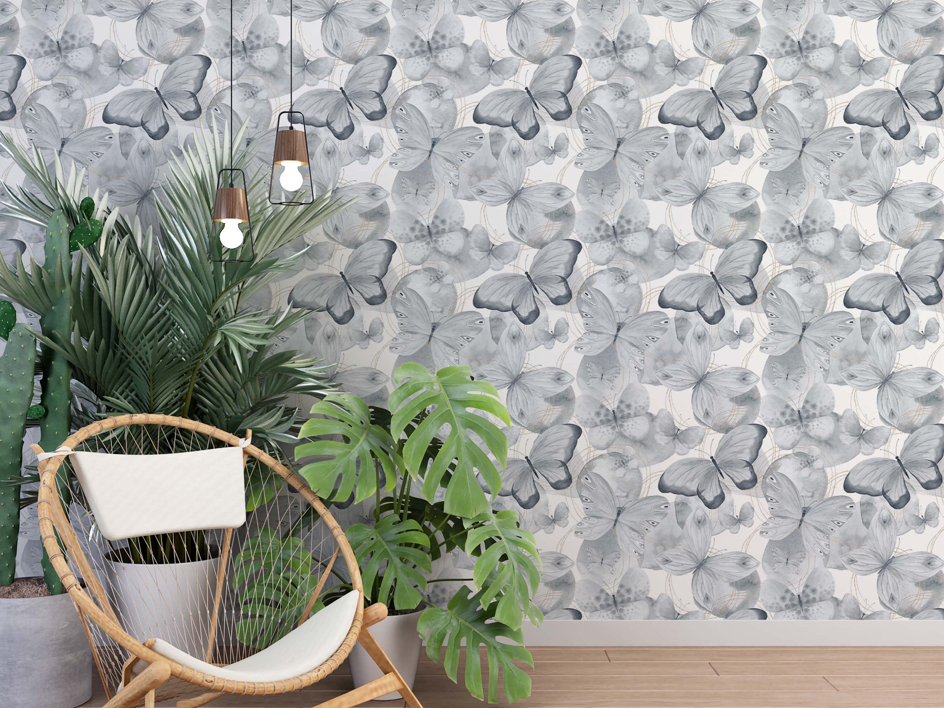 Repeating wallpaper pattern of grayscale butterflies in a watercolor style, with subtle gold circular line details.