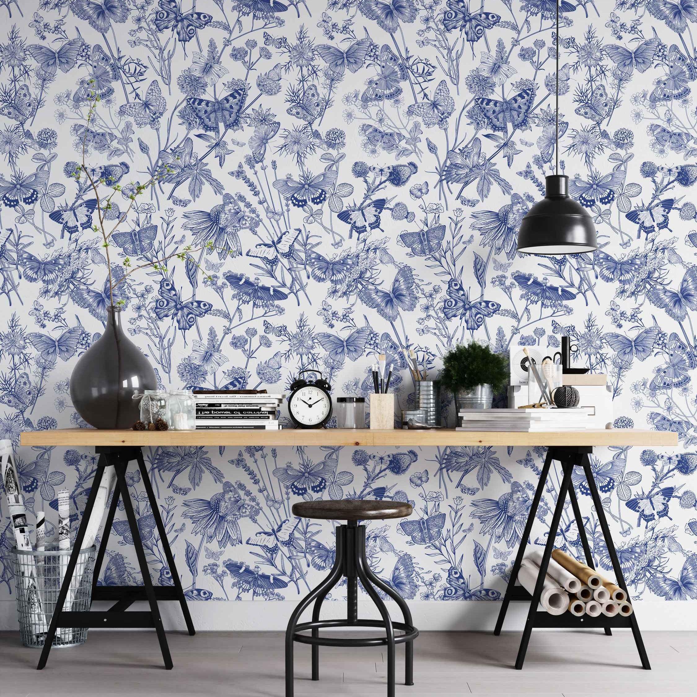 Blue line art wallpaper depicting sketched butterflies and various wildflowers on a white background in a dense repeating pattern.