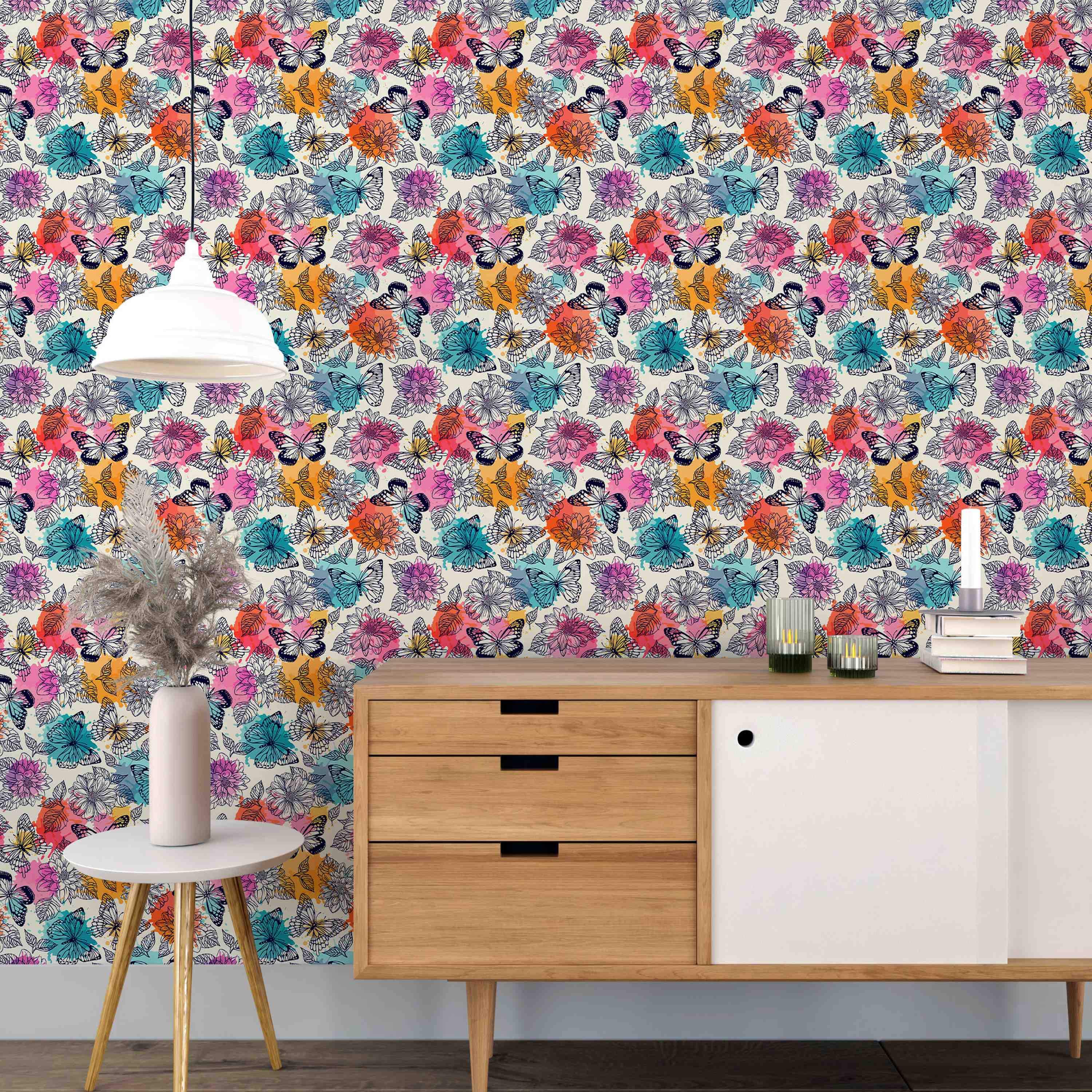 Wallpaper featuring line art butterflies and flowers over splashes of pink, orange, teal, and purple watercolor.