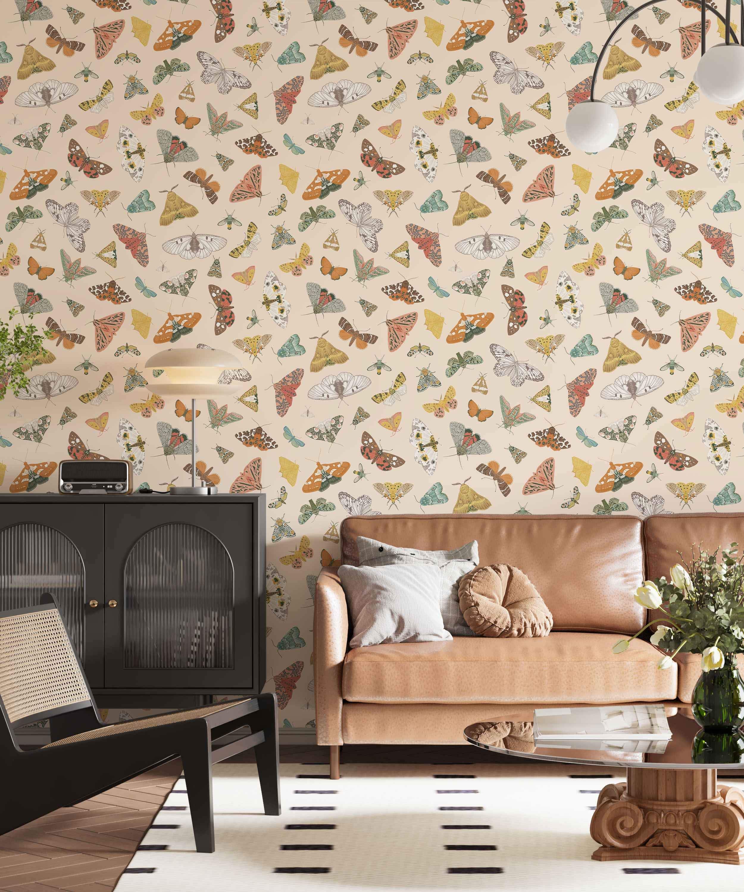 Colorful butterfly and moth pattern on beige wallpaper.