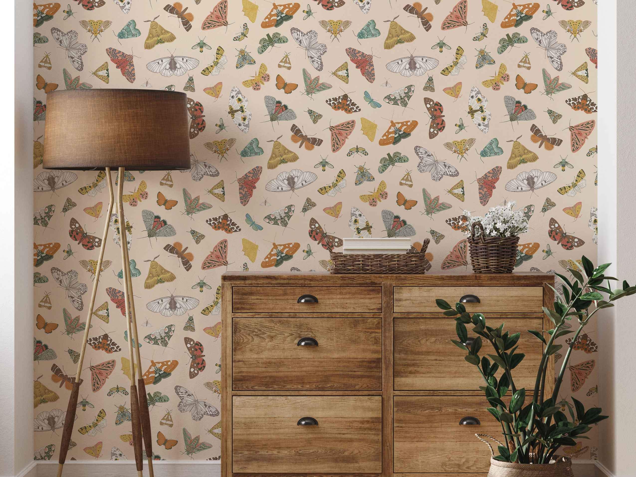 Colorful butterfly and moth pattern wallpaper with beige background.