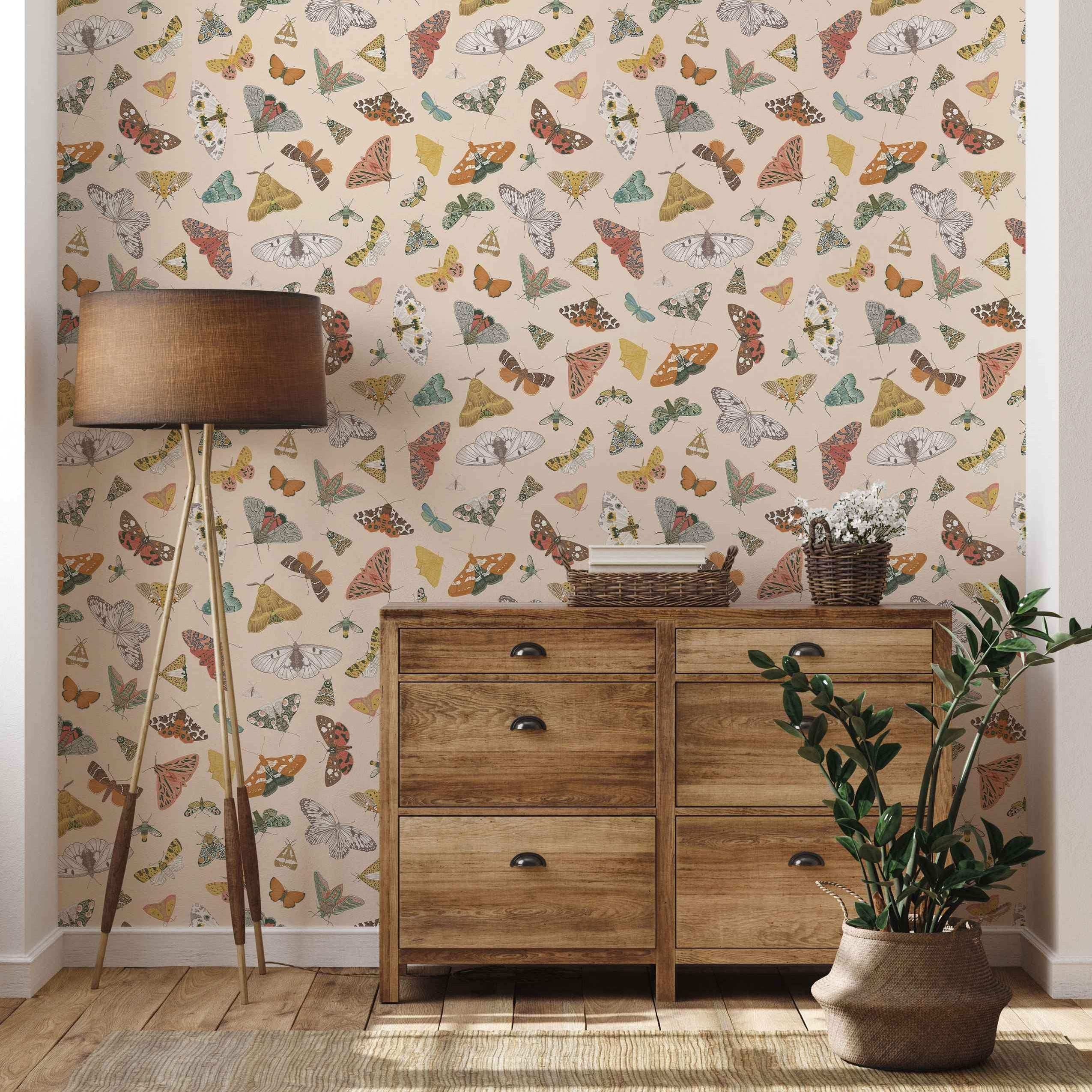 Colorful butterfly and moth pattern wallpaper with beige background.