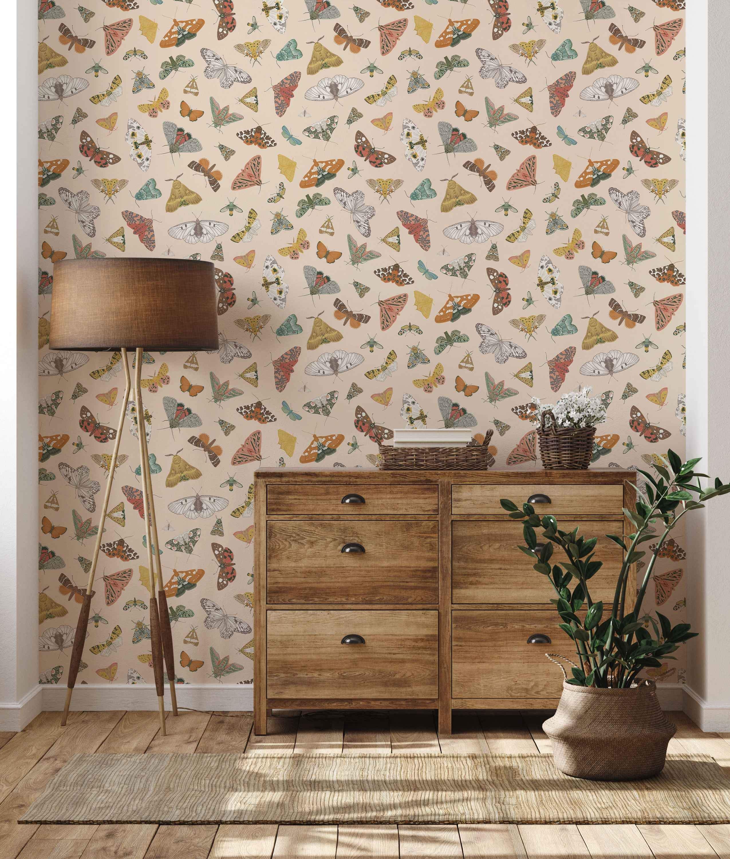 Colorful butterfly and moth pattern wallpaper with beige background.