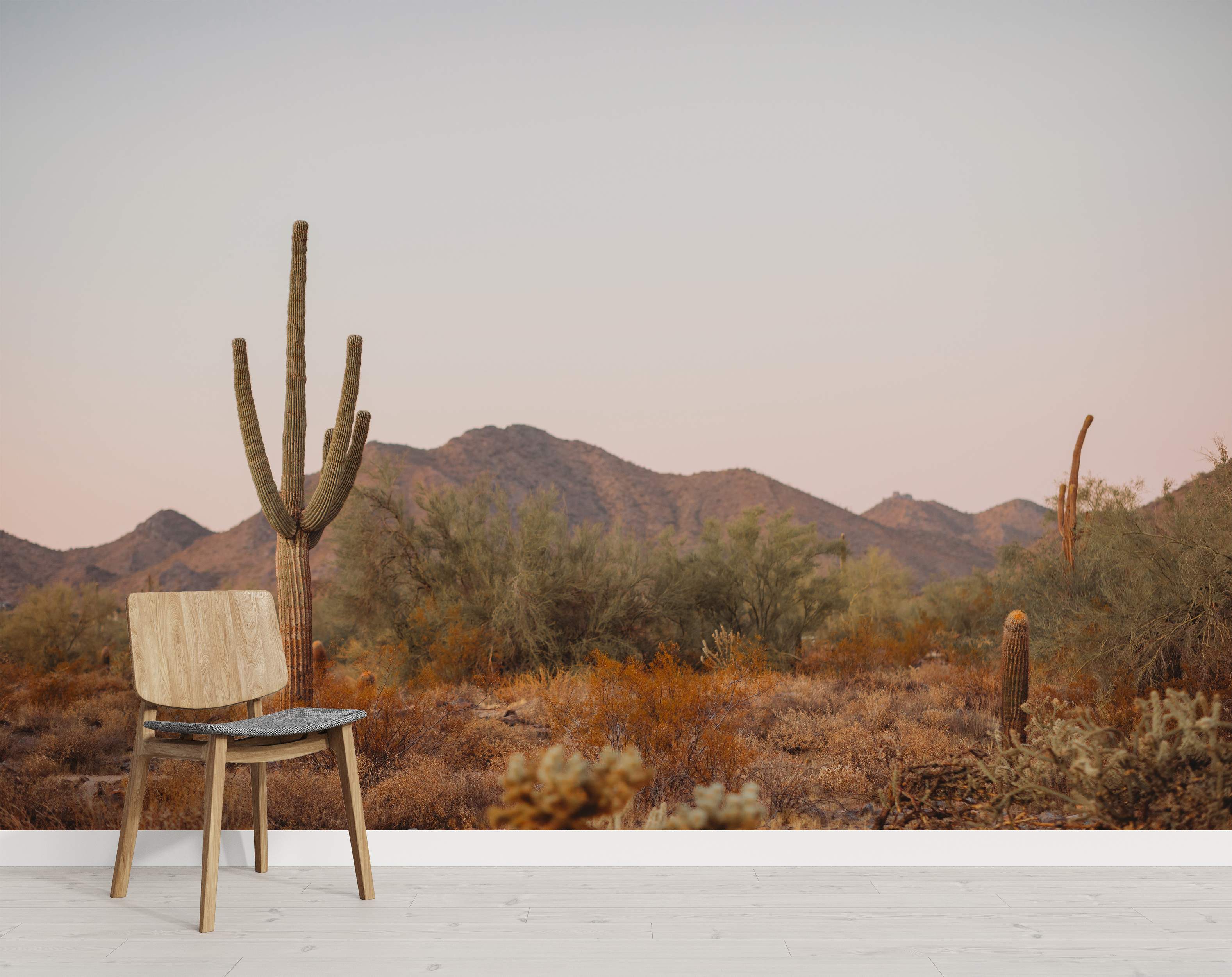 Desert landscape mural with cacti and mountains in earthy tones