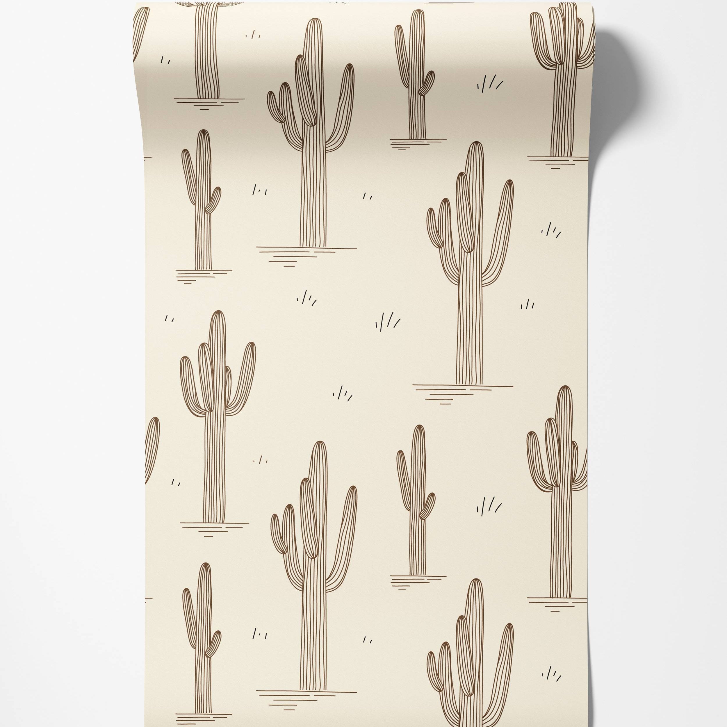 Beige wallpaper with a repeating pattern of brown line-art saguaro cacti and small accent dashes, creating a desert motif.