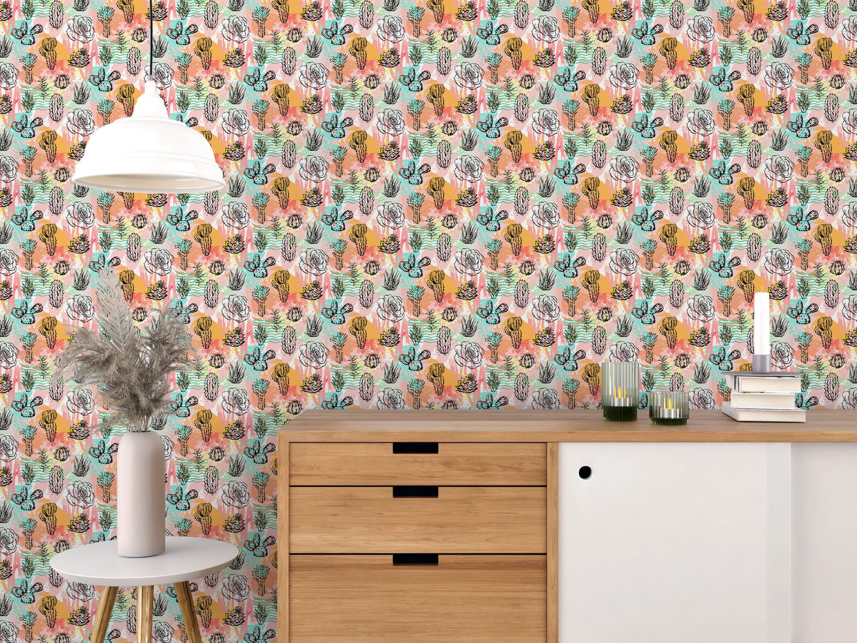 Wallpaper featuring black sketch-style cacti, succulents, and roses over pink, orange, yellow, and teal abstract watercolor splotches.
