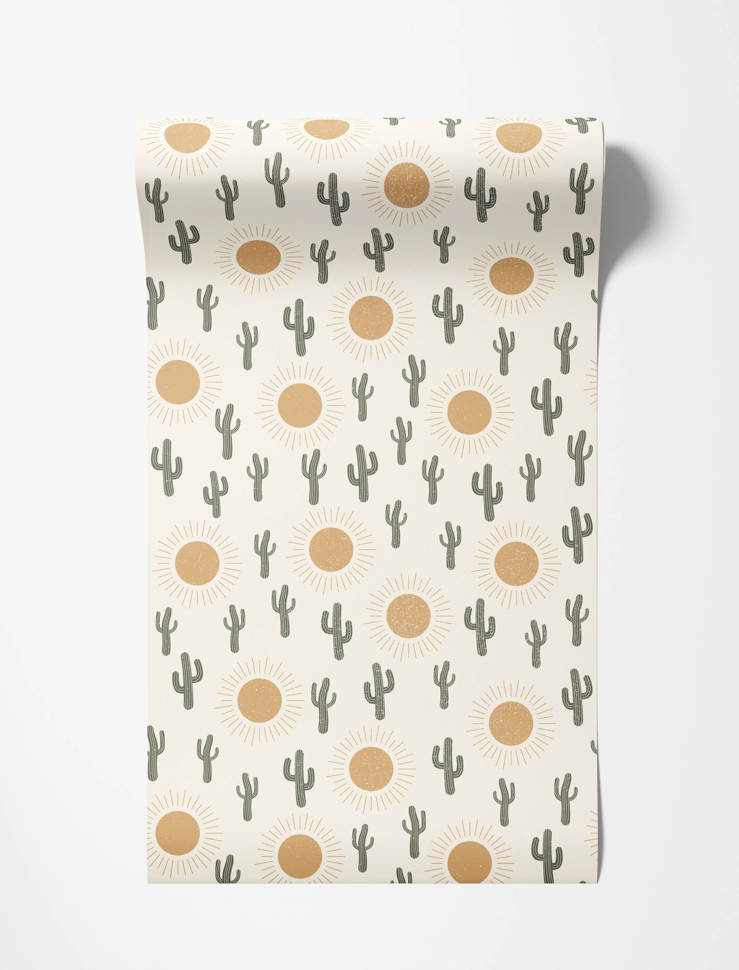 Wallpaper with a repeating pattern of stylized dark green cacti and distressed orange suns on an off-white background.
