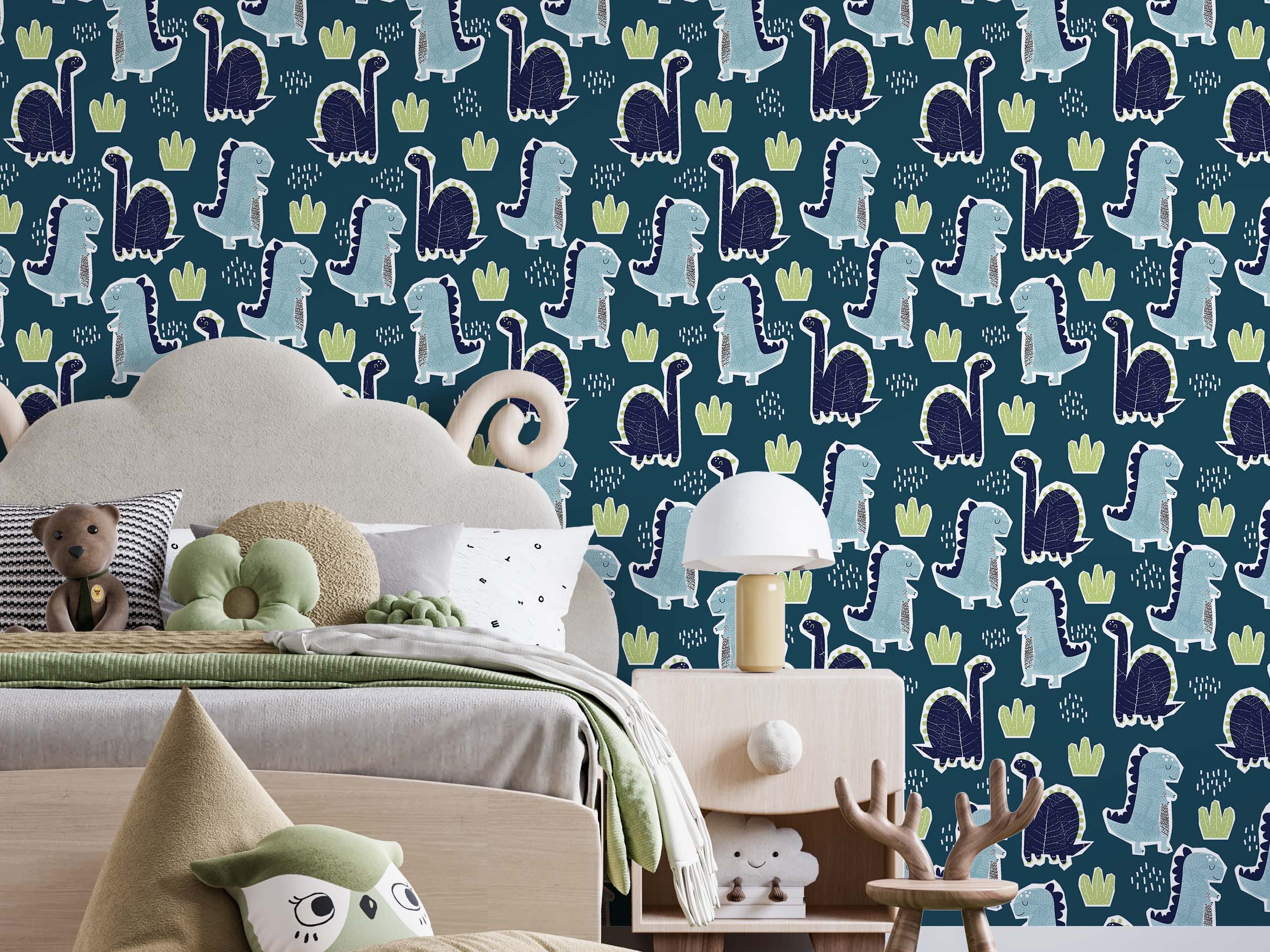 Cartoon dinosaur wallpaper with light blue and dark blue dinosaurs, green plant motifs, and white speckles on a deep teal background.