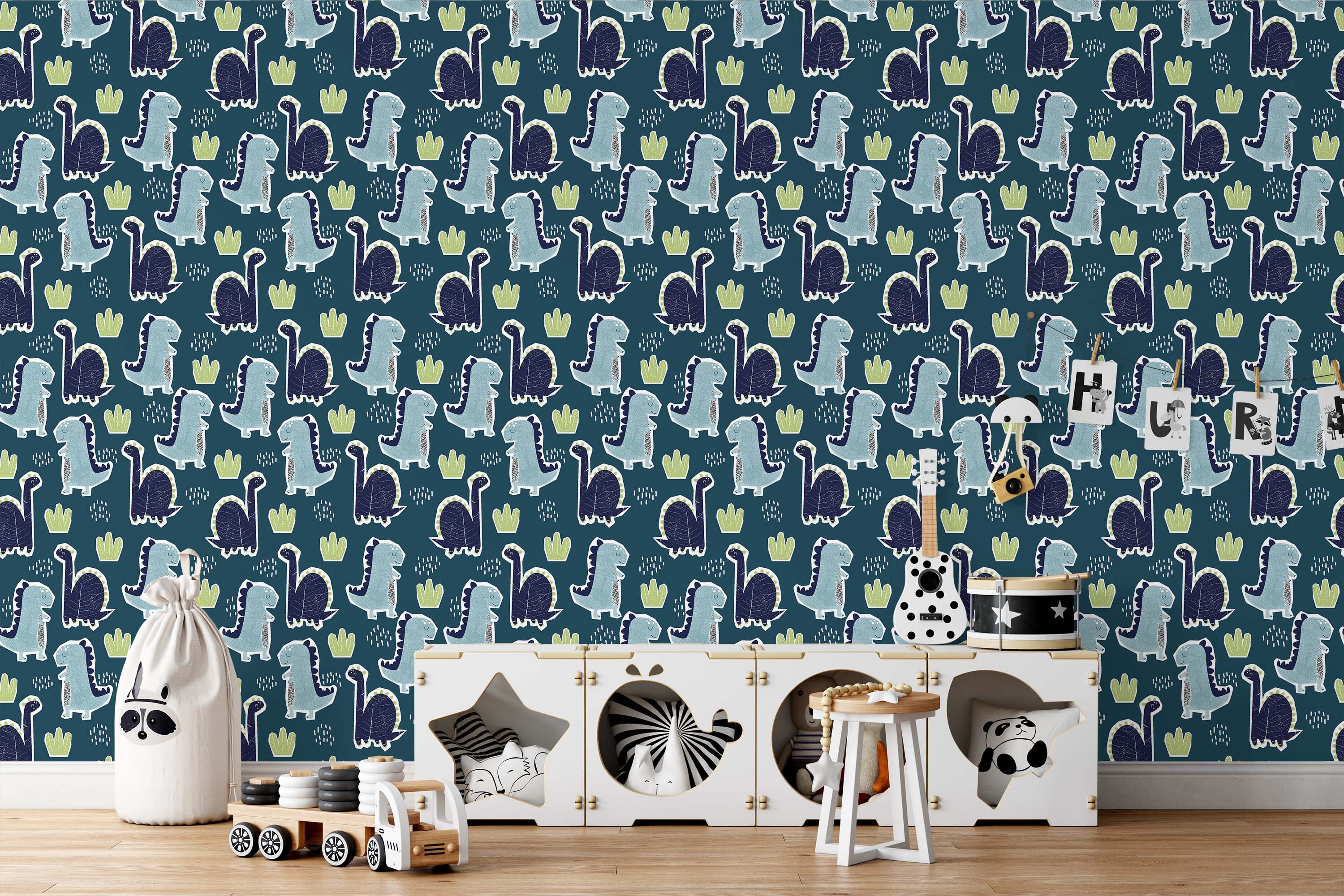 Wallpaper with a repeating pattern of light blue and dark blue cartoon dinosaurs and lime green plants on a dark teal background.