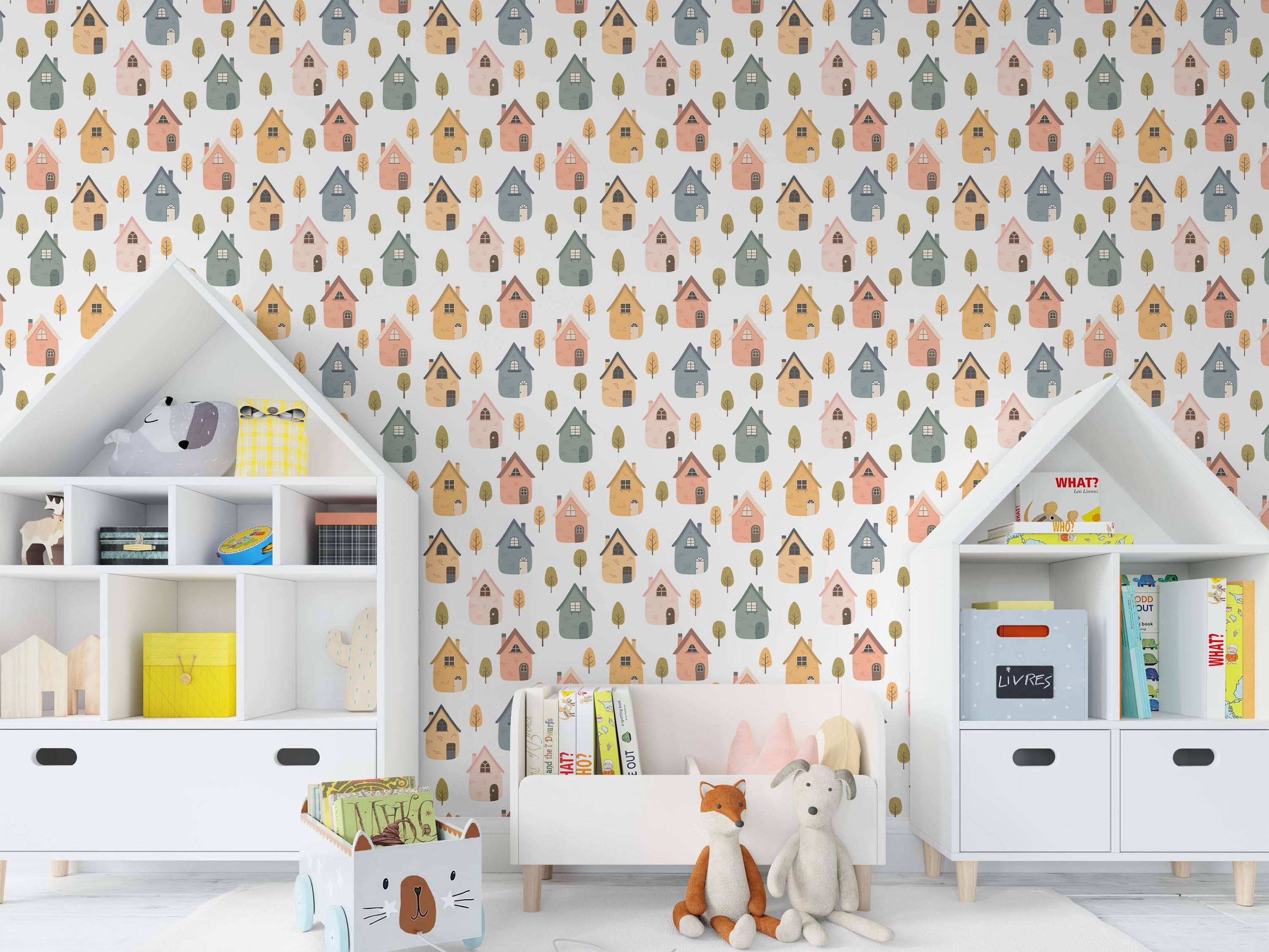 Cute repeating wallpaper pattern of stylized houses in yellow, peach, blue, and green, with small trees on a white field.