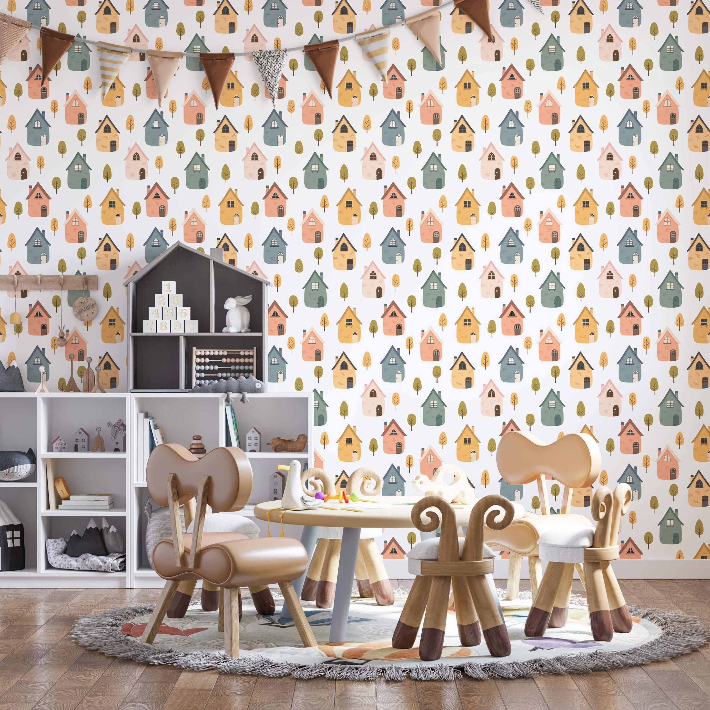 Wallpaper featuring a repeating pattern of colorful cartoon houses in blue, pink, yellow, and green, with small trees on a white background.