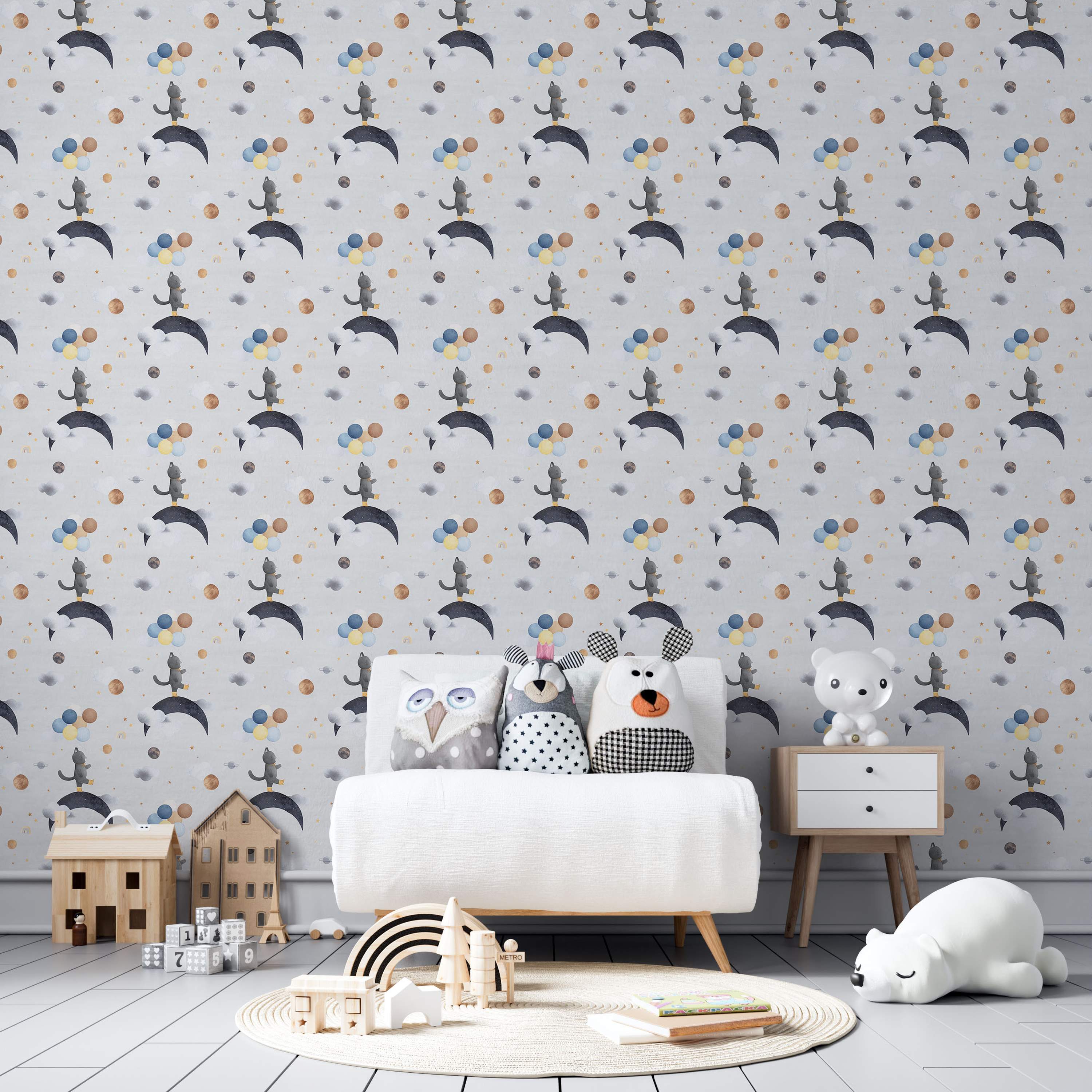 Repeating wallpaper with watercolor gray cats on moons, surrounded by planets, balloons, and clouds in blue, yellow, and gold.