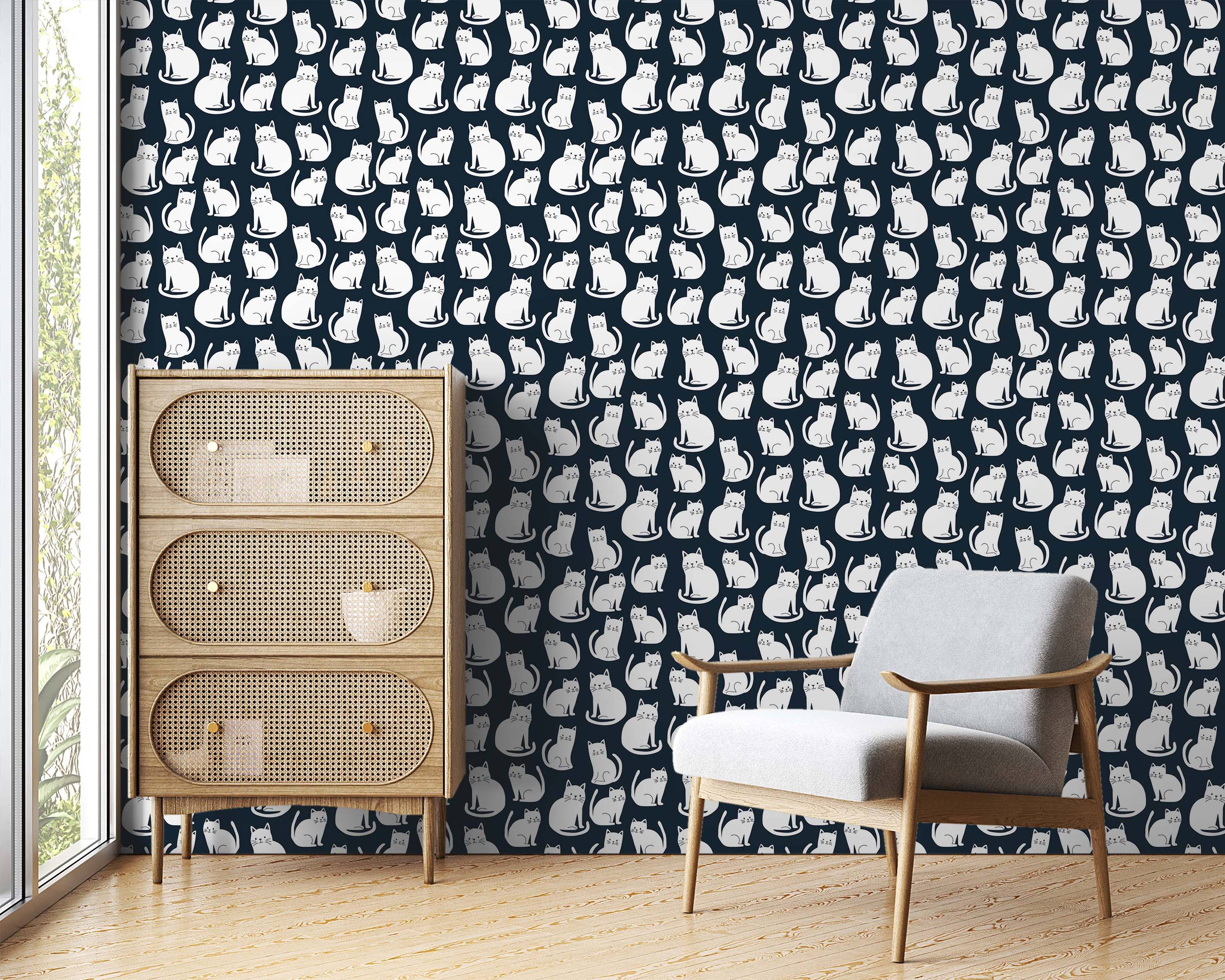 Wallpaper featuring a repeating pattern of stylized white cat illustrations sitting against a dark navy blue background.
