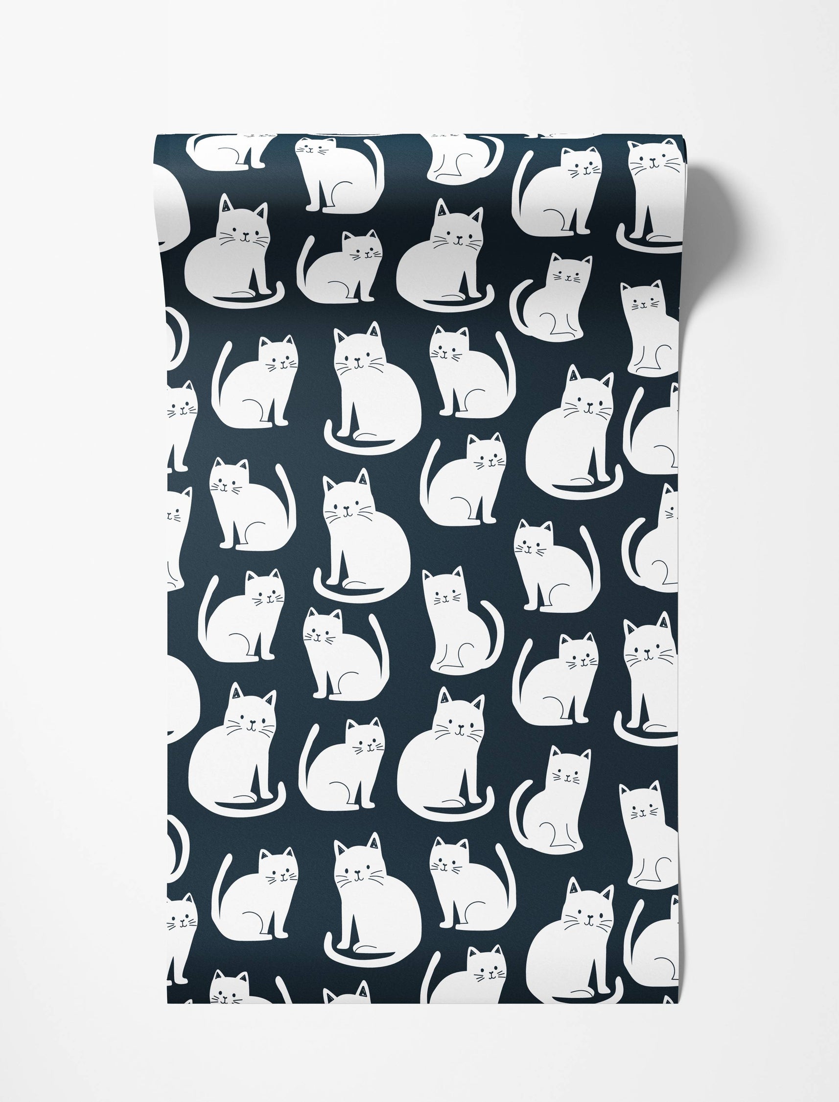 Wallpaper featuring a repeating pattern of simple white cartoon cats in various sitting poses on a dark navy blue background.