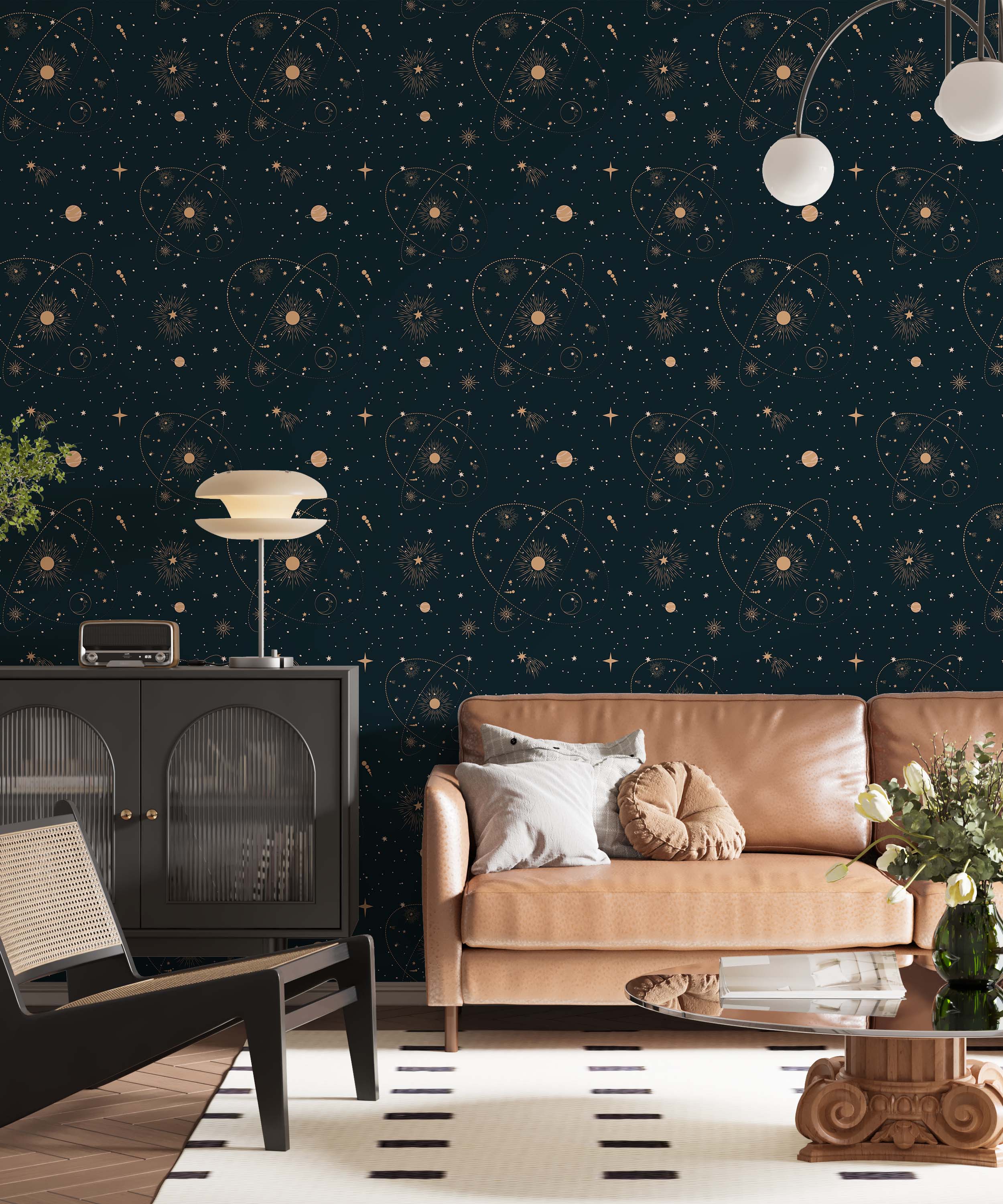 Dark blue wallpaper featuring a celestial pattern with gold stars, suns, planets, and orbital lines.