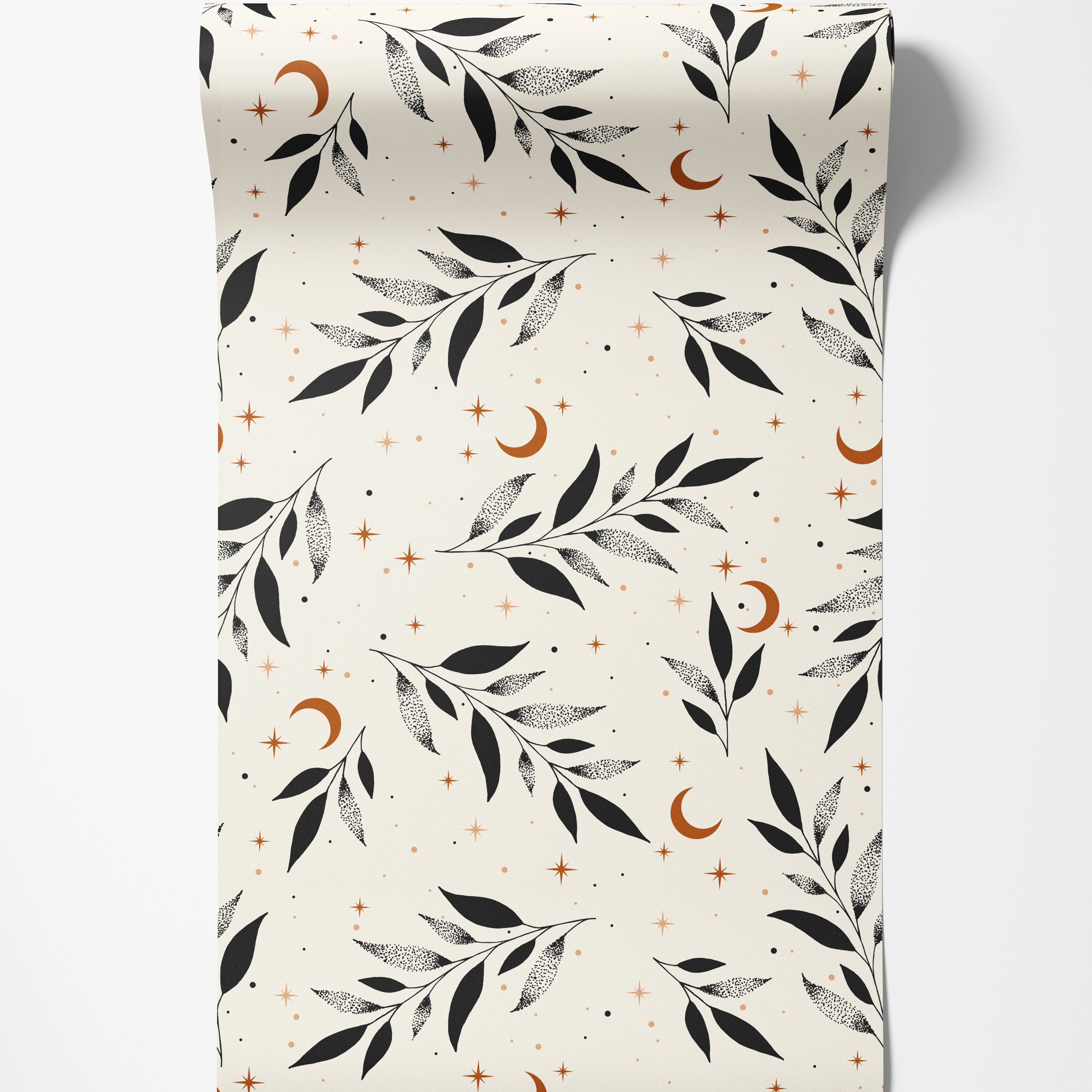 A celestial wallpaper with black stippled leaves, rust-colored crescent moons, and stars on a cream background.