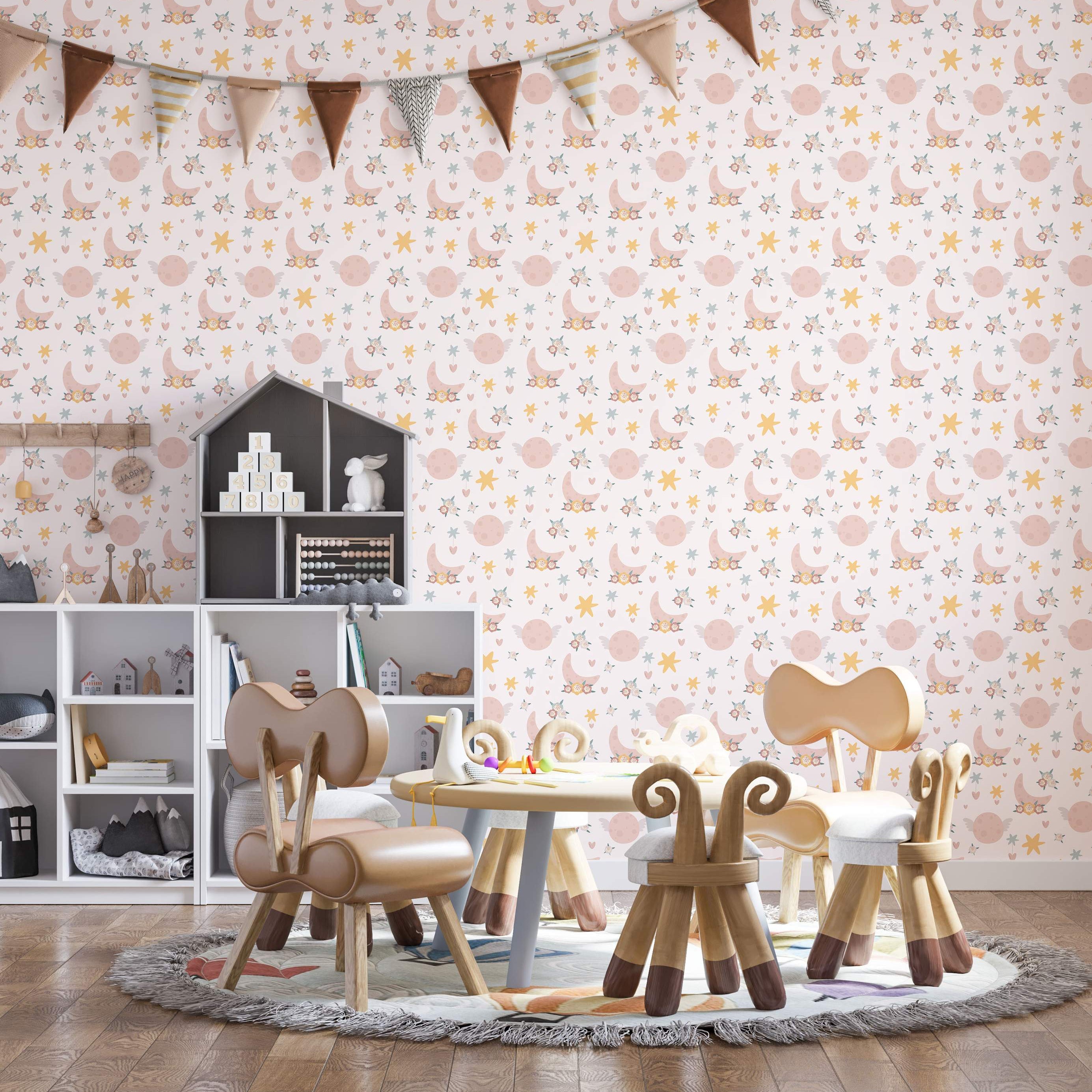 Whimsical wallpaper with pink floral crescent moons, winged planets, yellow and blue stars, and hearts on a light background.