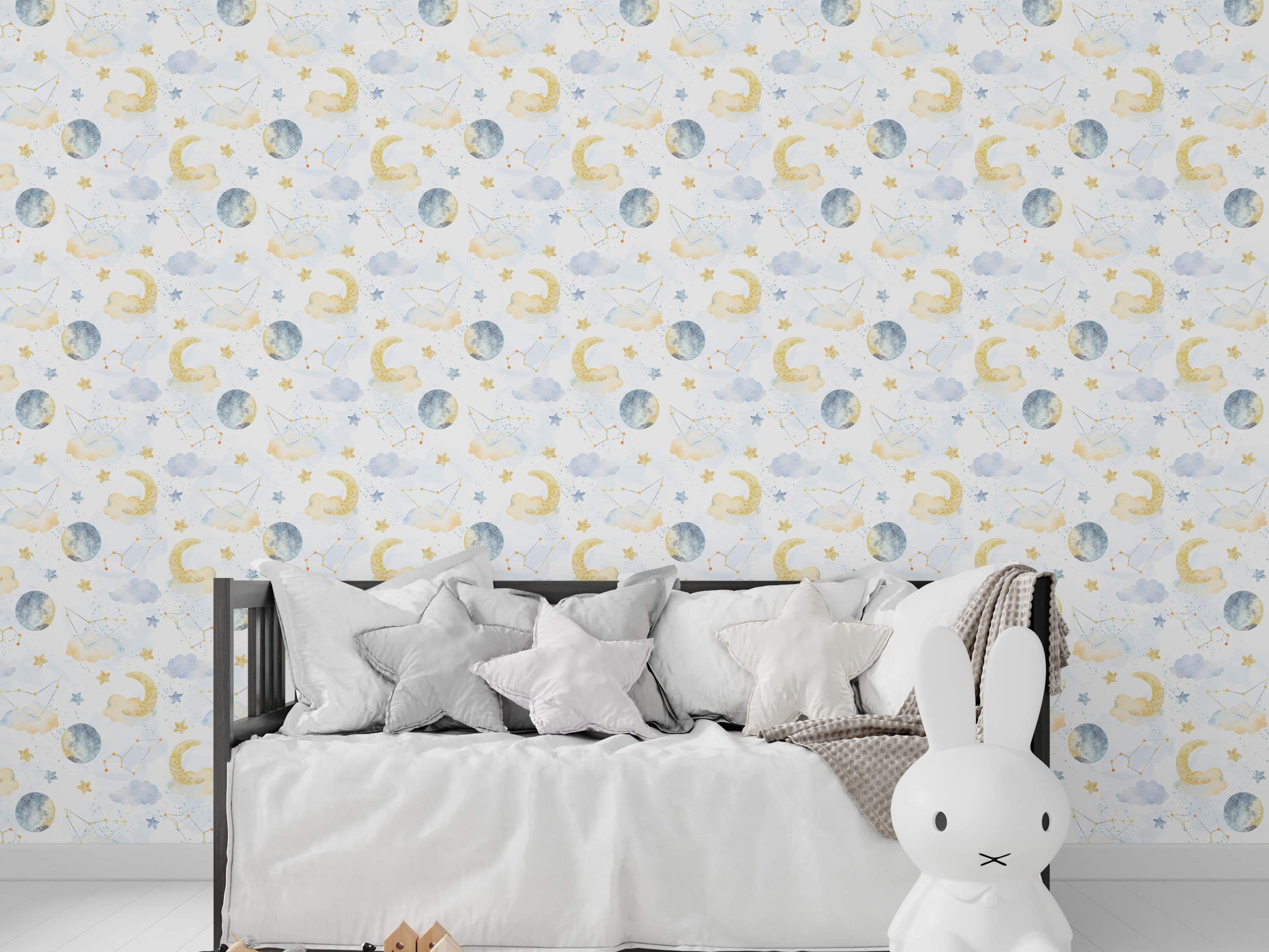 Watercolor celestial wallpaper featuring yellow crescent moons, gray full moons, blue clouds, stars, and constellations on a light background.