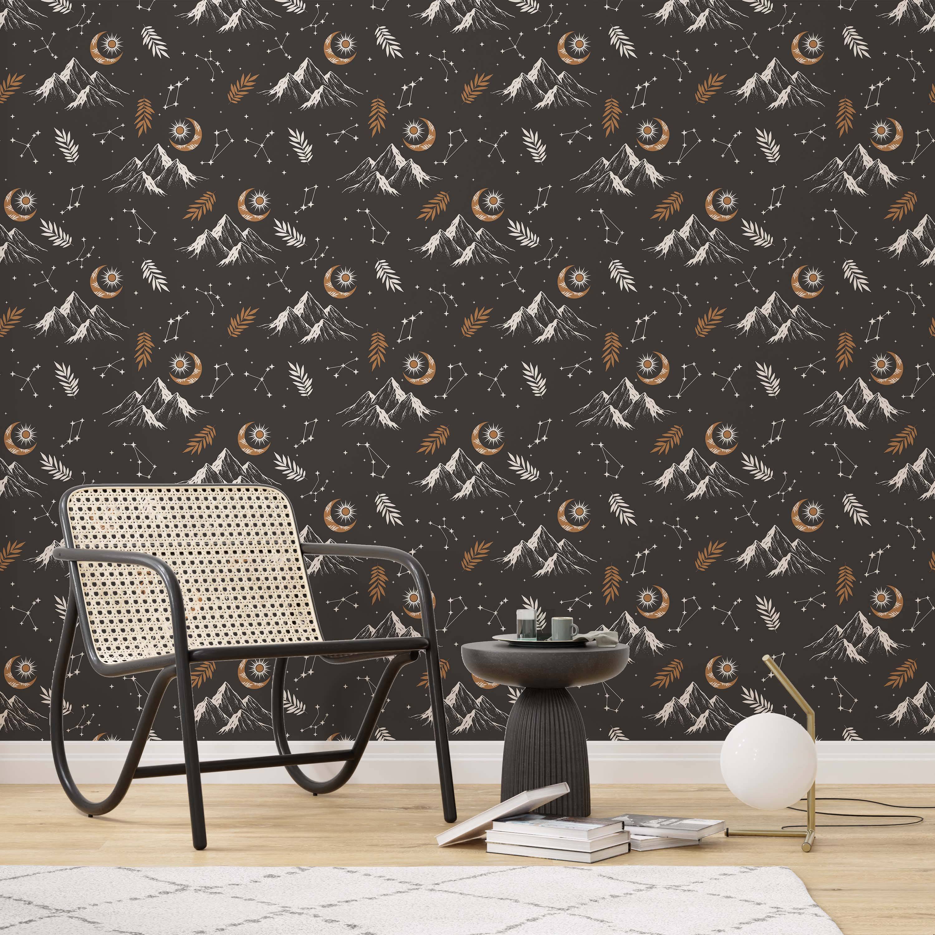 Wallpaper with a celestial mountain theme featuring white and gold moons, suns, stars, and leaves on a dark gray background.