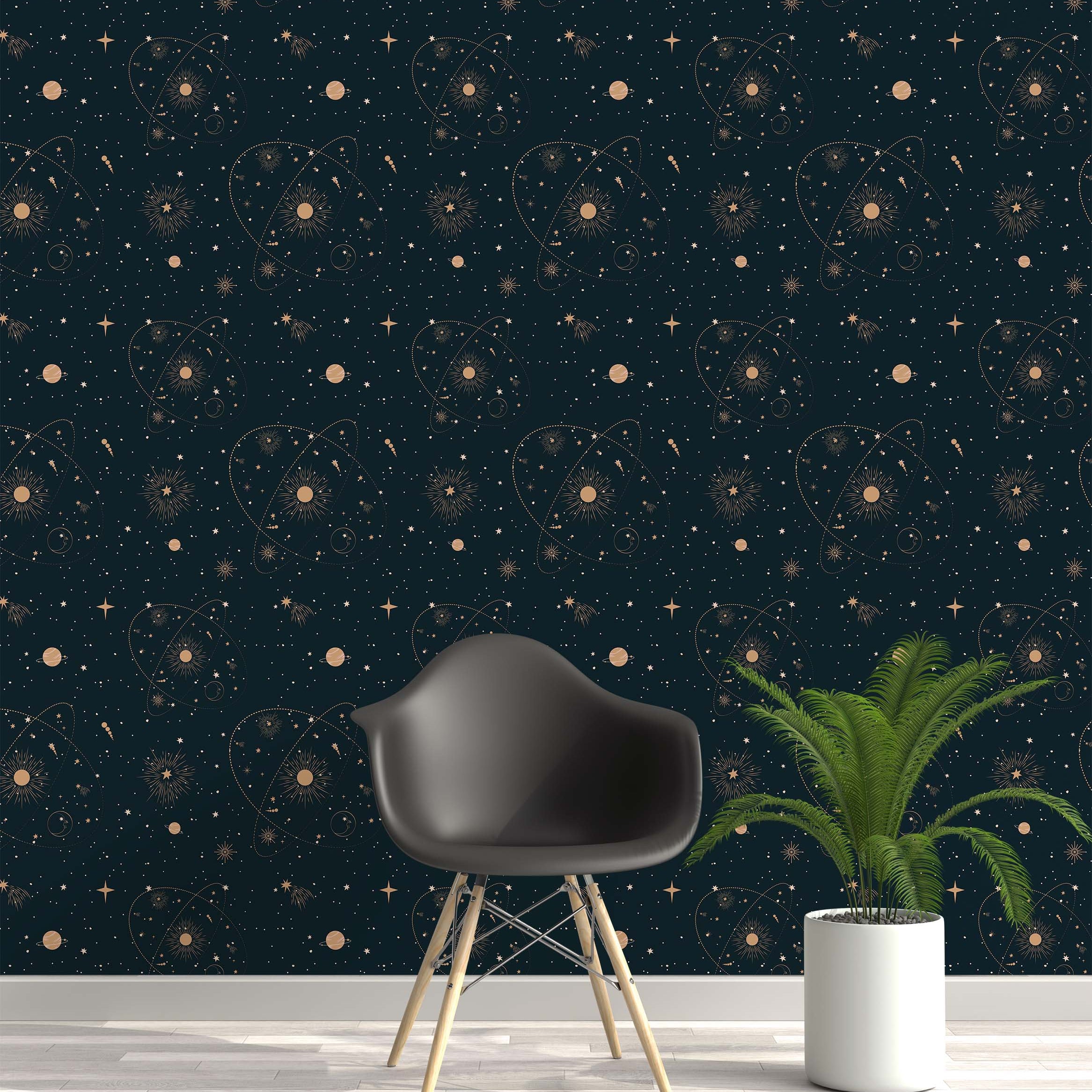 Dark teal wallpaper with a repeating pattern of golden celestial elements, including suns, various stars, planets, and orbits.