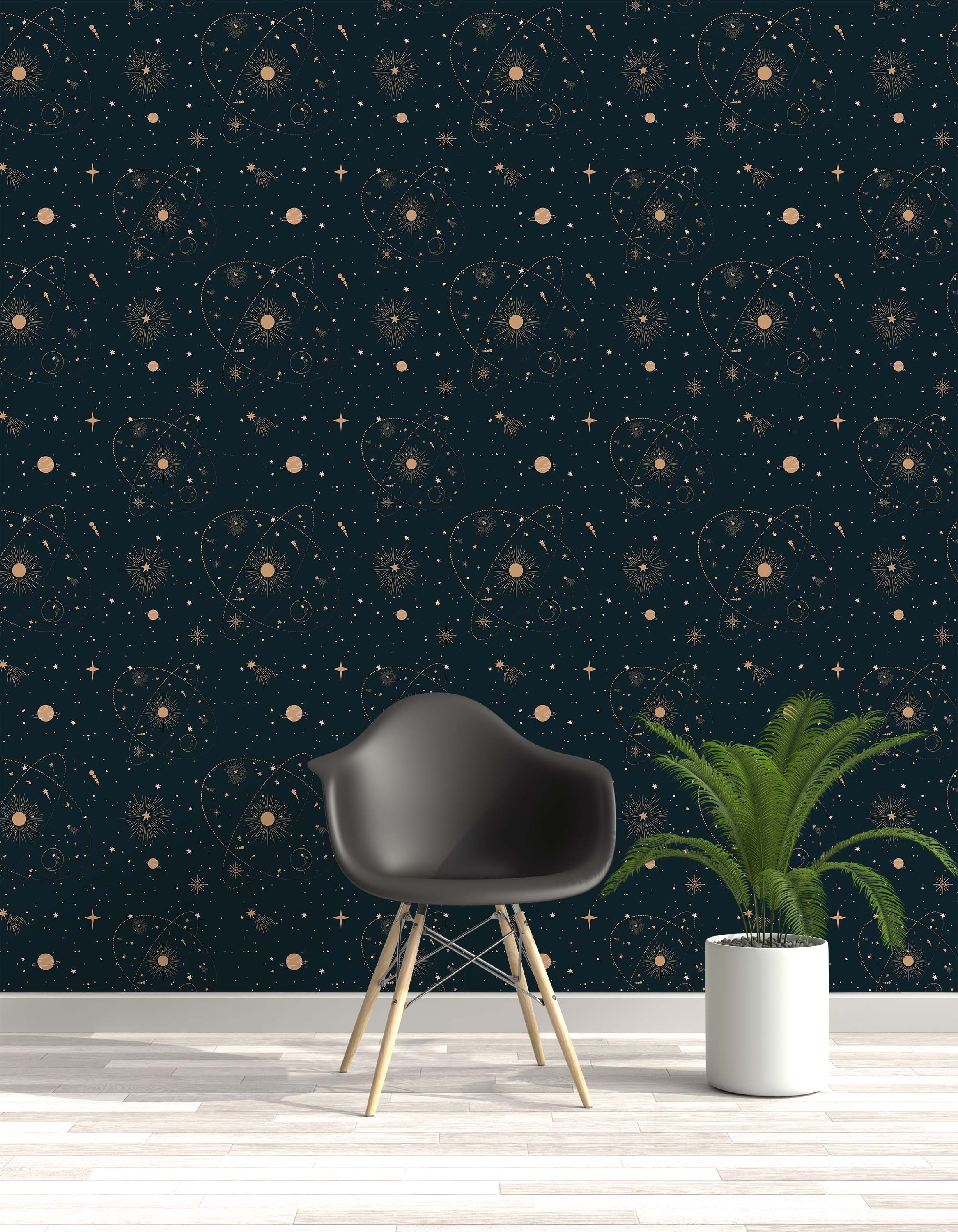 Dark teal wallpaper with a repeating pattern of golden celestial elements, including suns, various stars, planets, and orbits.