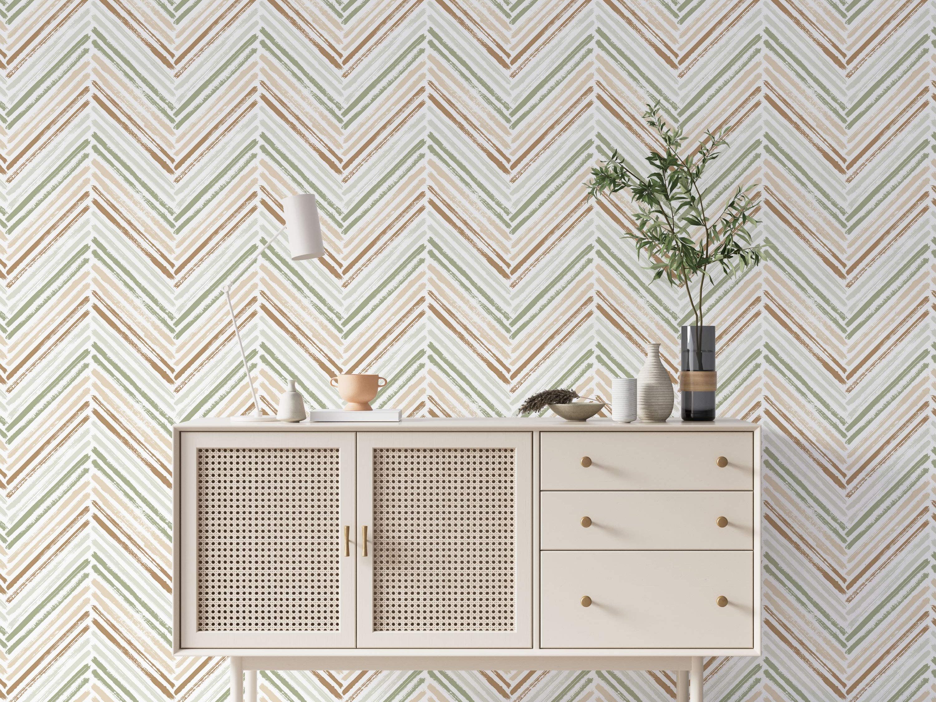 Brushstroke chevron wallpaper in earthy green, brown, and beige tones against a light background.