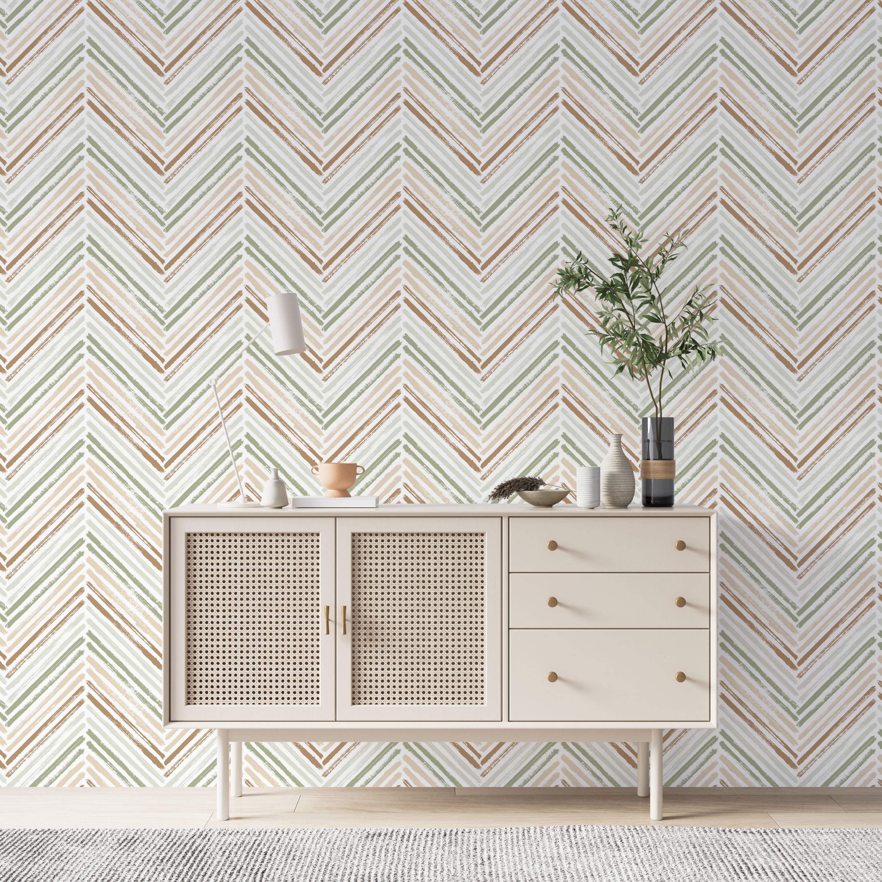 Brushstroke chevron wallpaper in earthy green, brown, and beige tones against a light background.