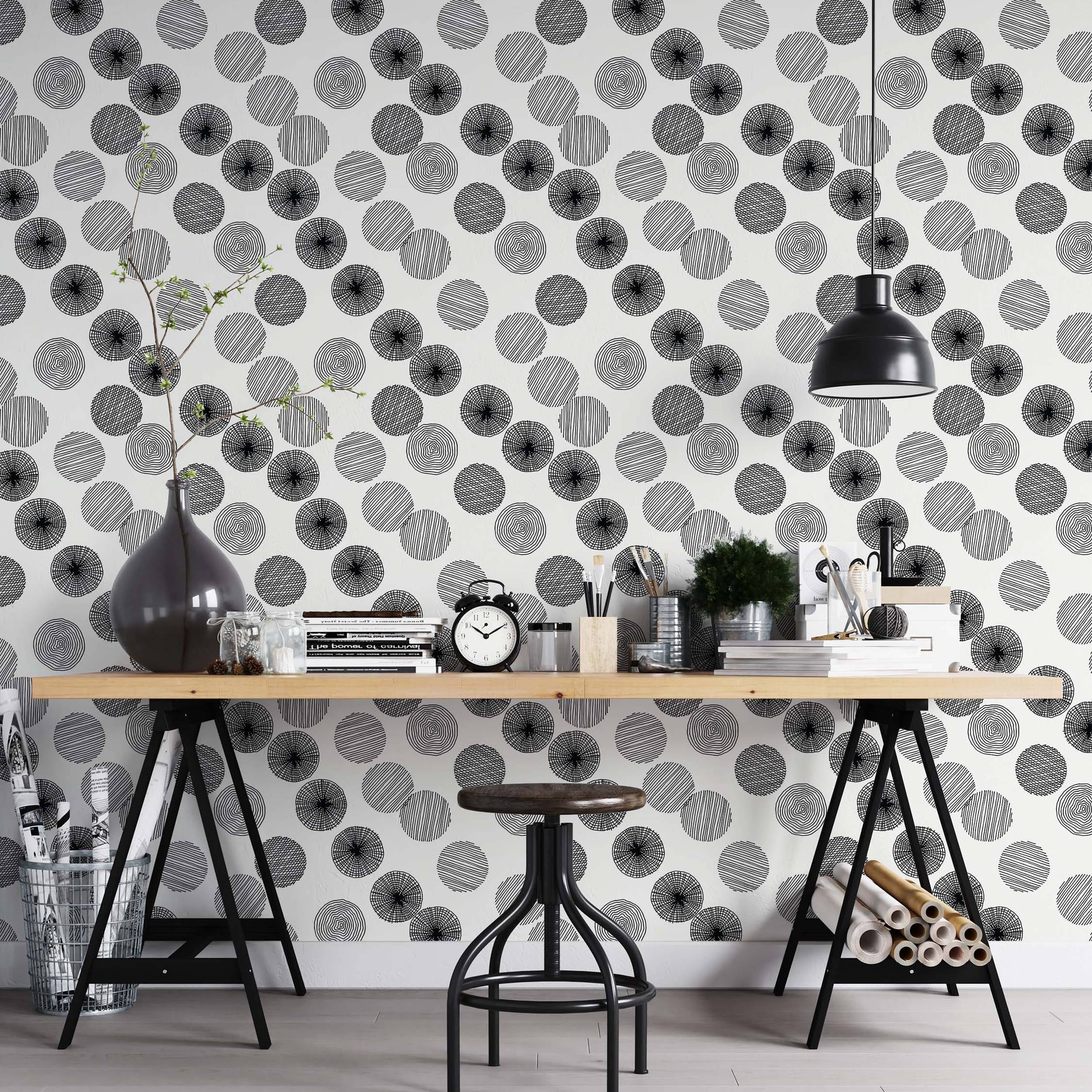 Wallpaper featuring black hand-drawn style circles with varied internal line patterns scattered across a white background.