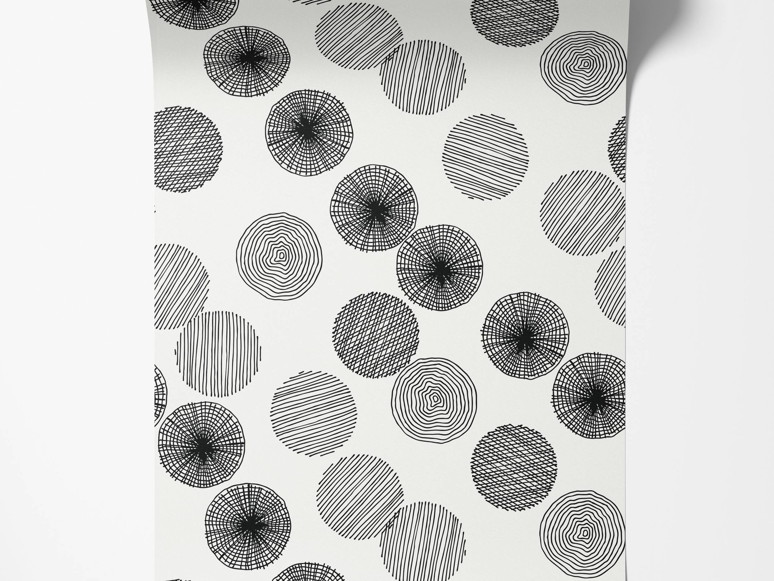 Black and white wallpaper with sketched circles filled with diverse line patterns like concentric rings and hatching.