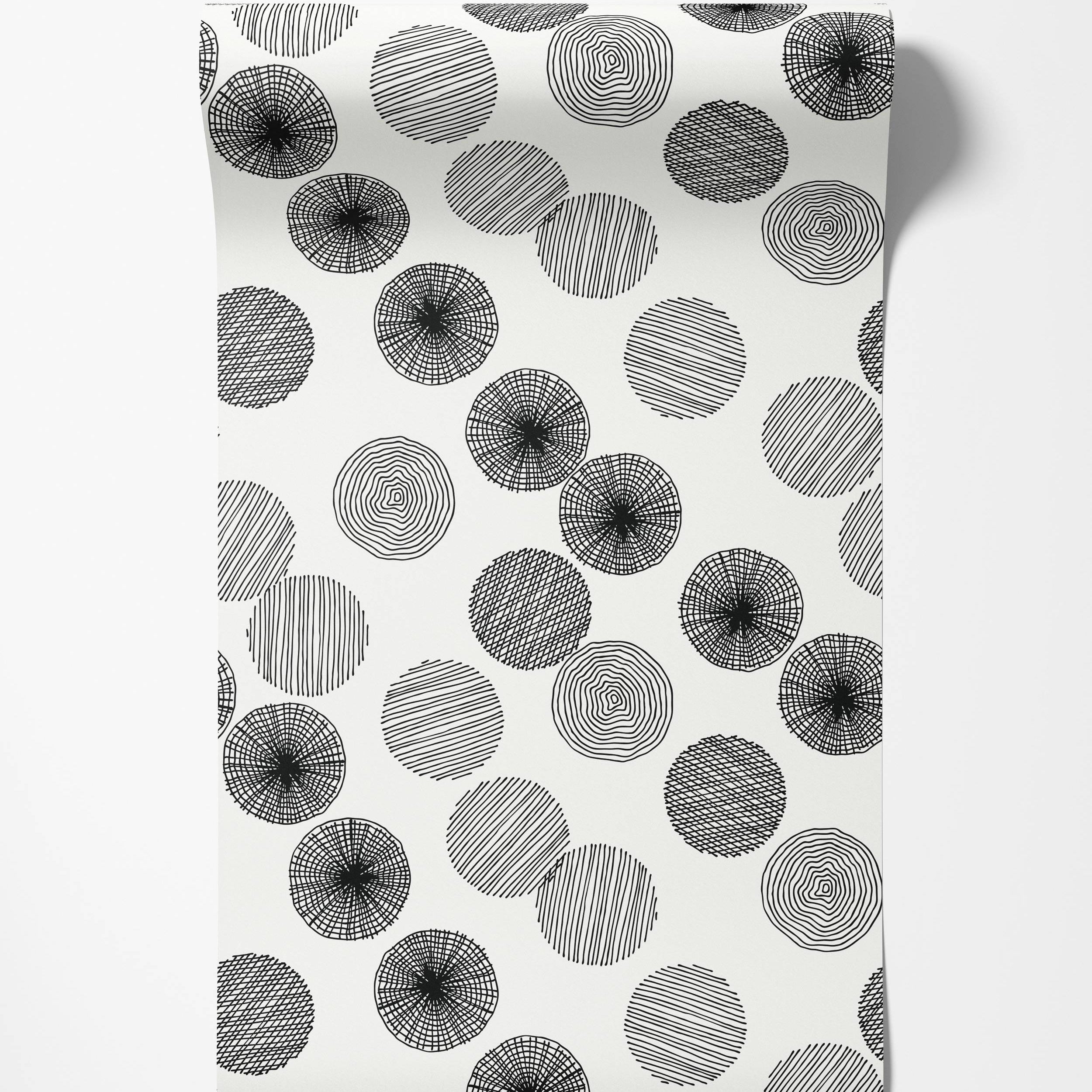 Black and white wallpaper with sketched circles filled with diverse line patterns like concentric rings and hatching.