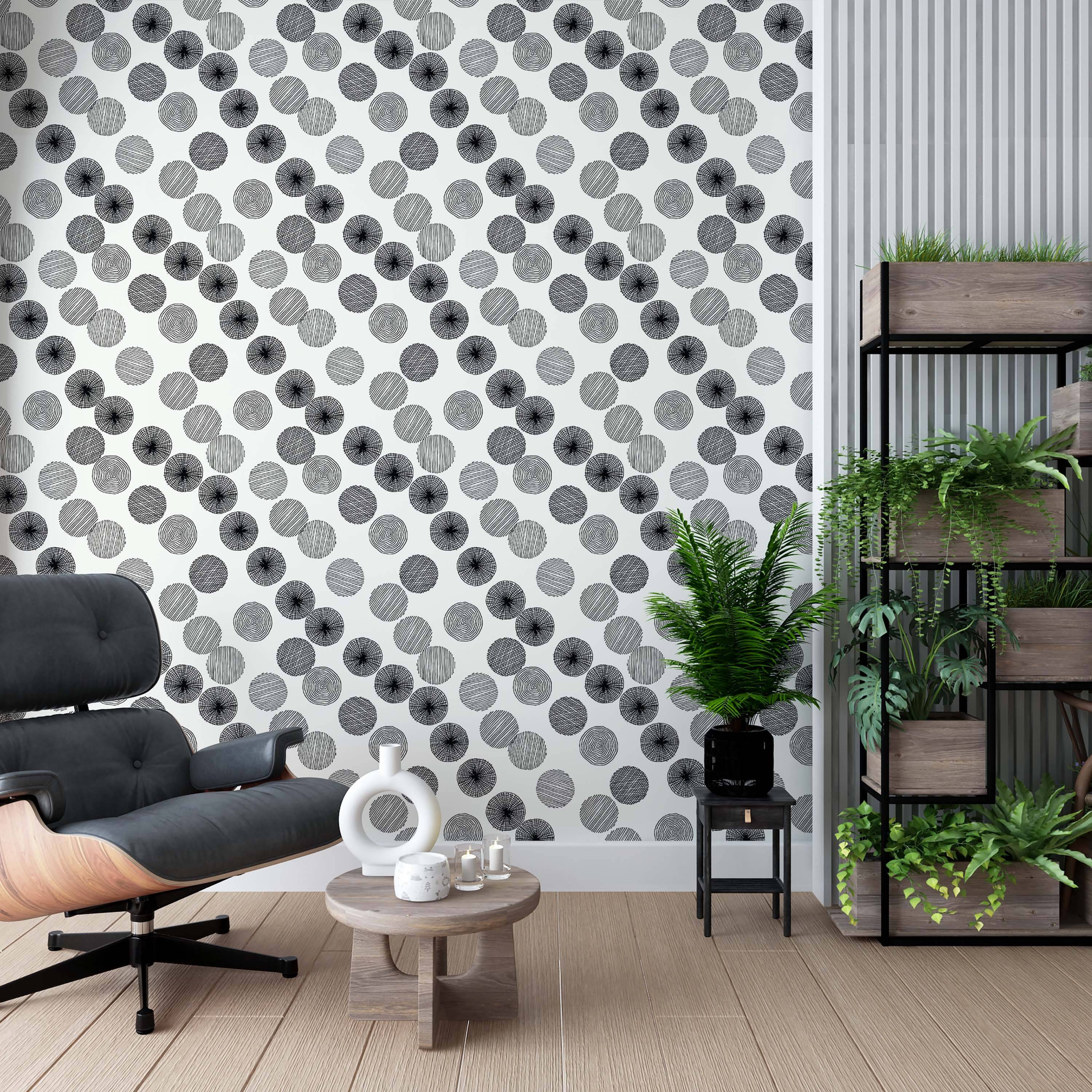 Wallpaper with overlapping circles filled with various black line patterns (concentric, radial, diagonal) on a white background.