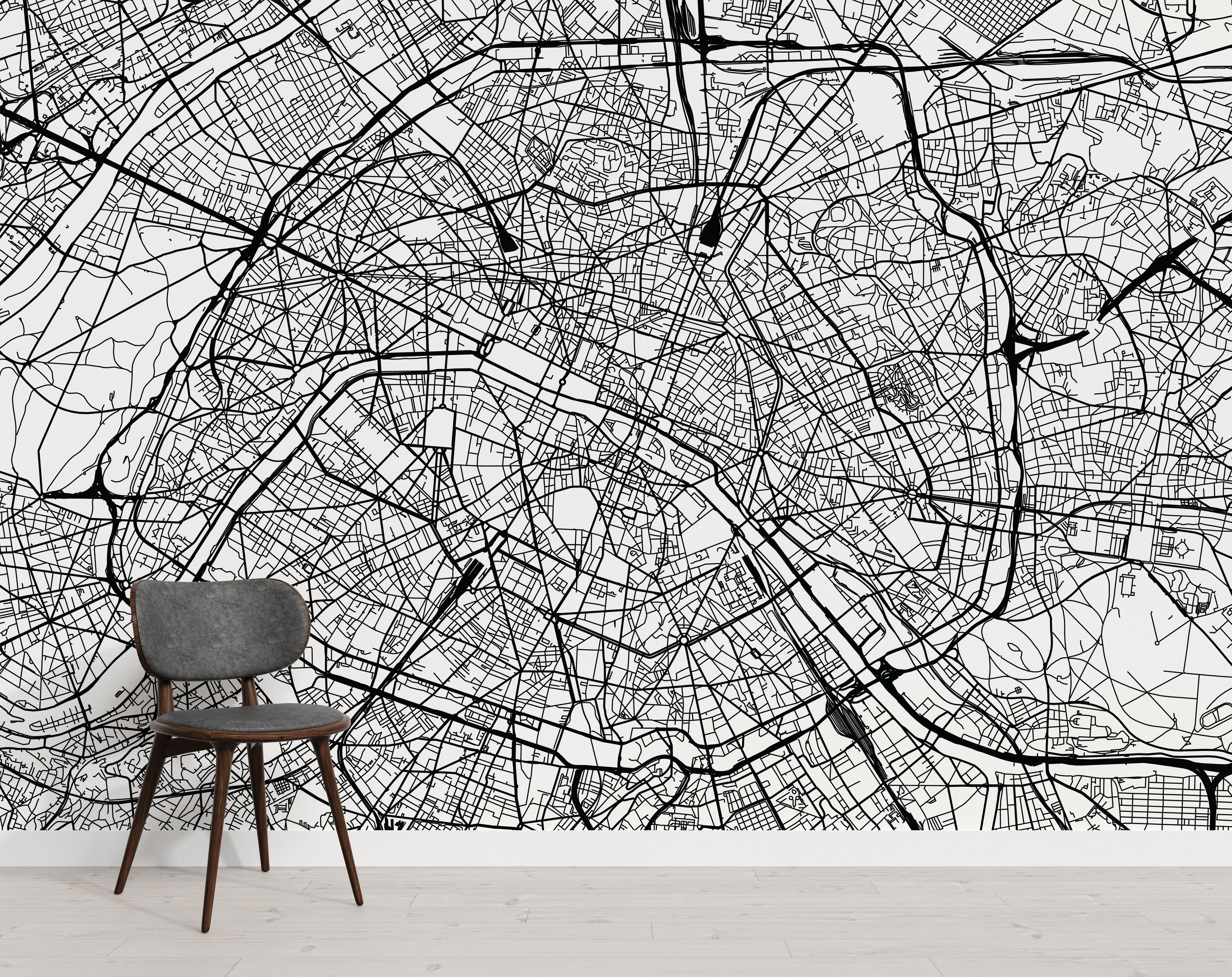 Monochrome city map mural with intricate black street lines on a white background.
