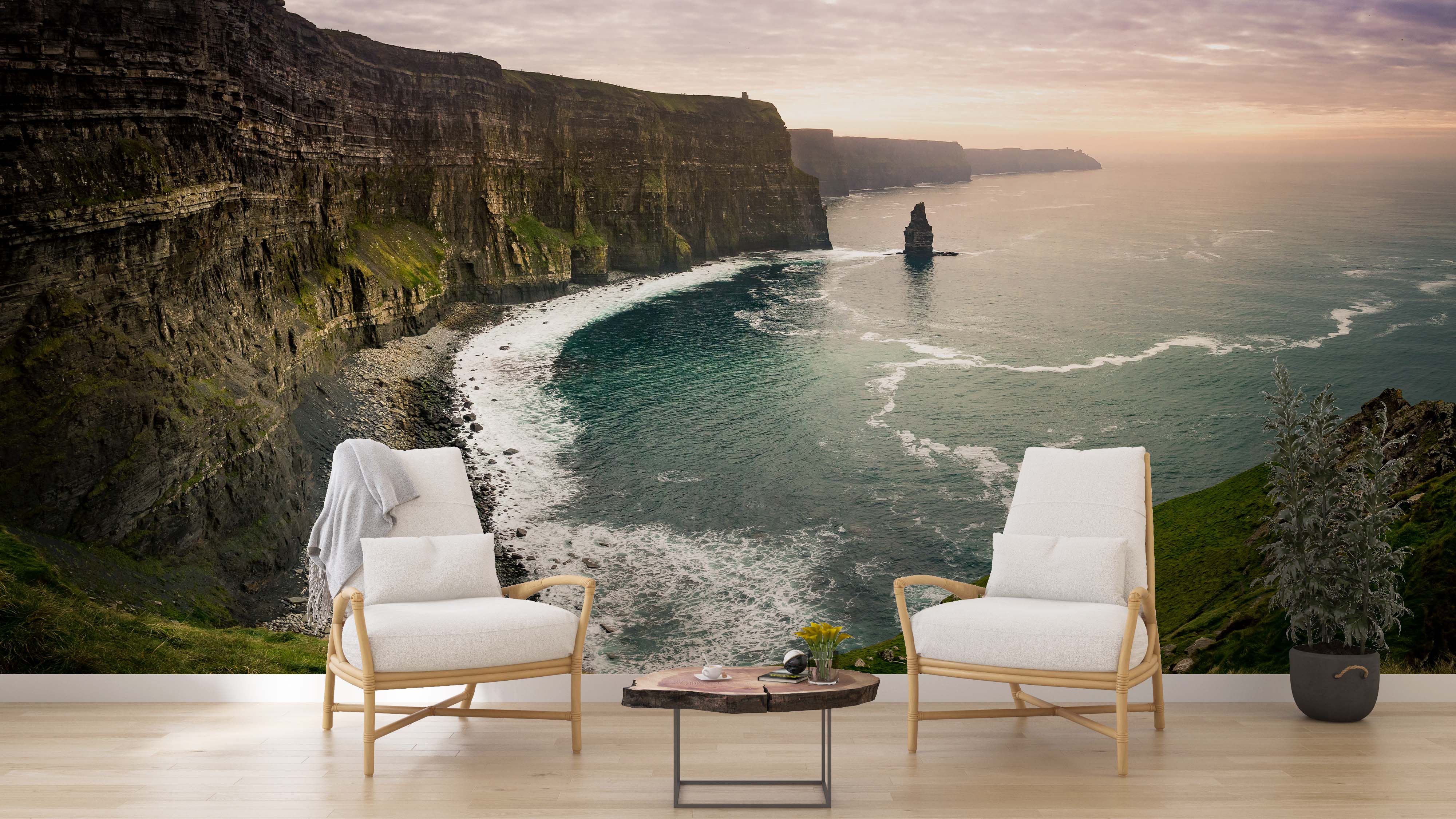 A photographic wall mural of the Cliffs of Moher, showing steep, dark cliffs meeting a teal ocean under a soft sunset sky.