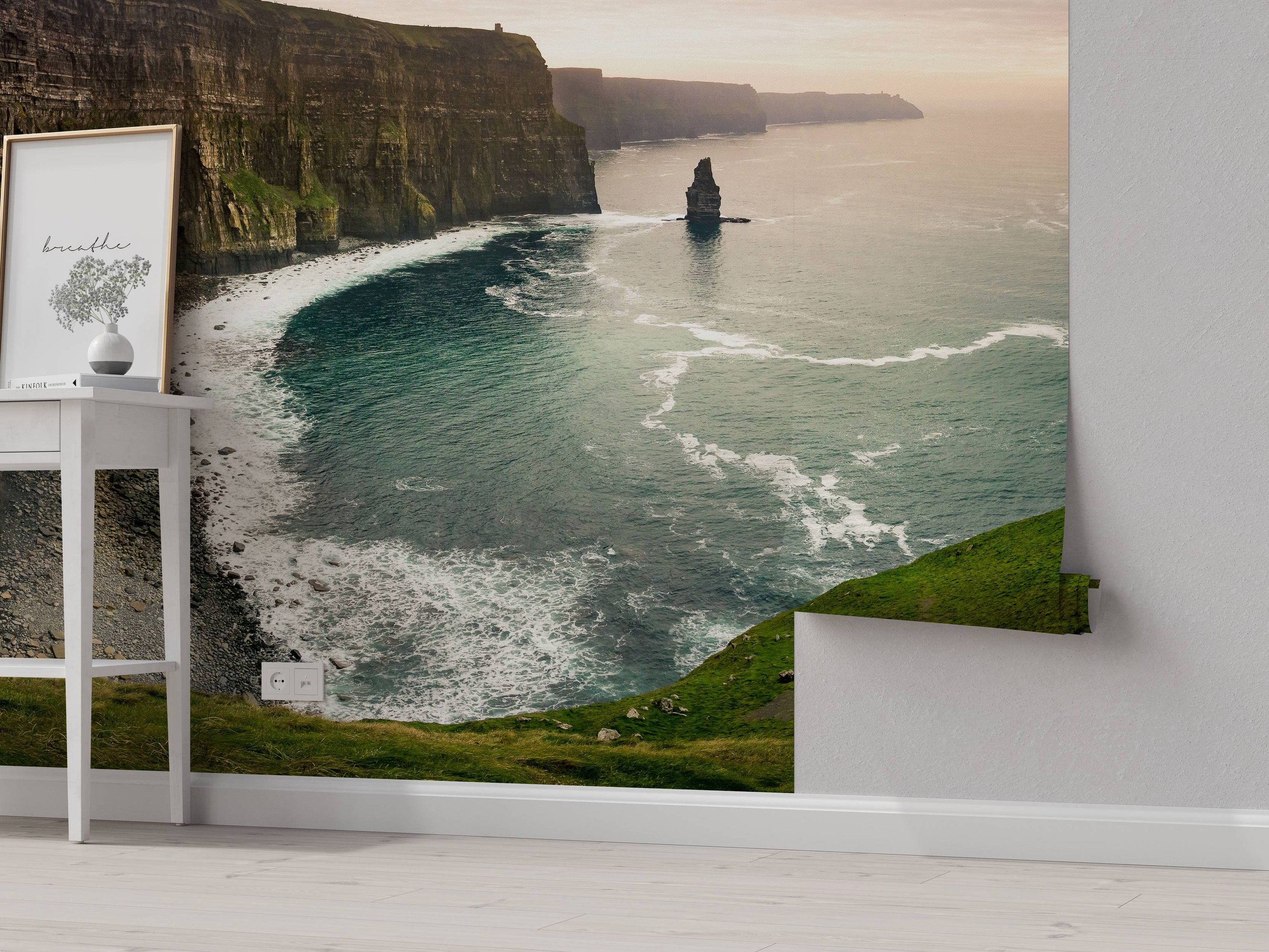 A scenic mural depicting the Cliffs of Moher, with rugged brown cliffs, green grassy tops, and a teal ocean at dusk.