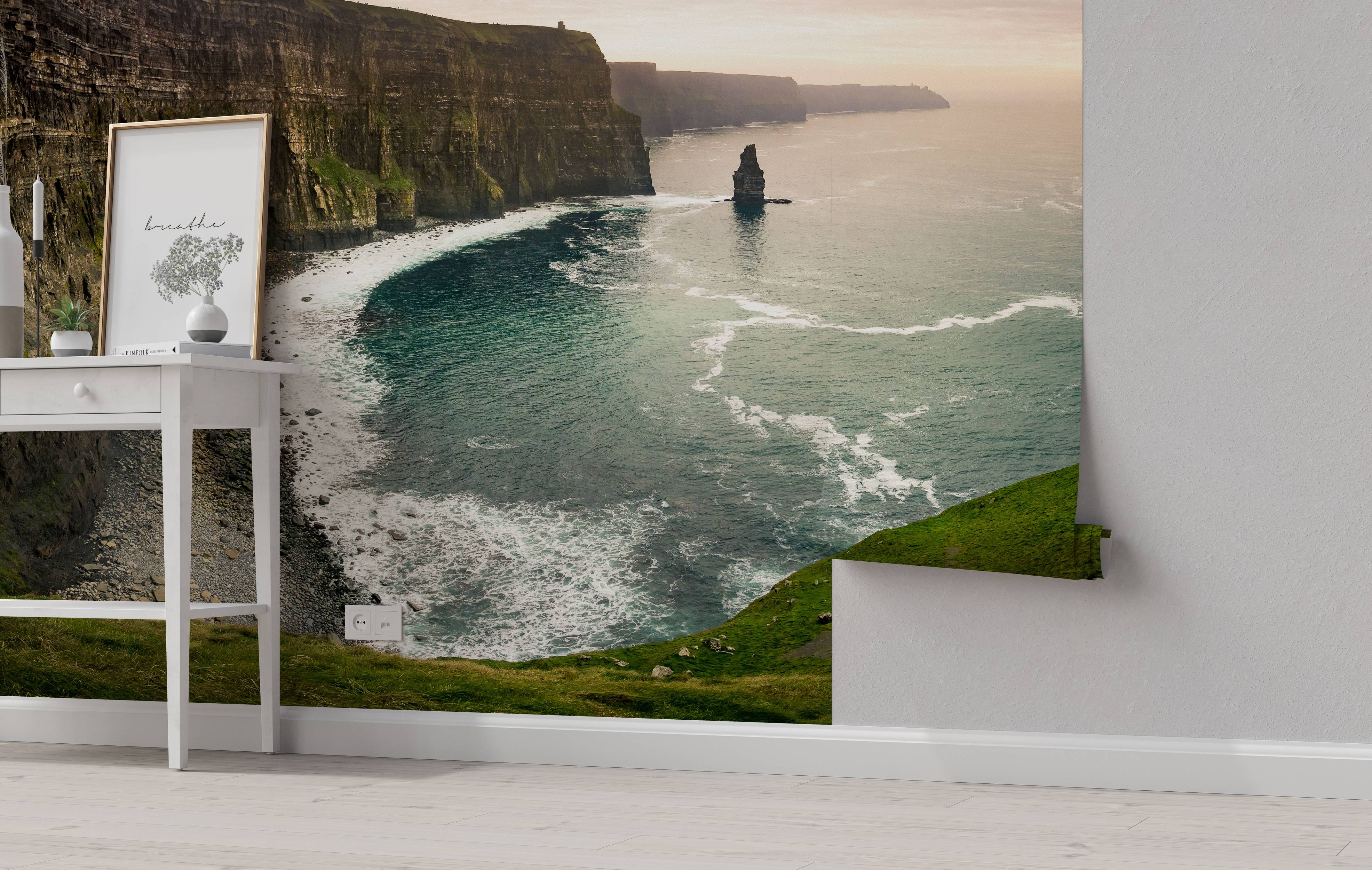 A scenic mural depicting the Cliffs of Moher, with rugged brown cliffs, green grassy tops, and a teal ocean at dusk.